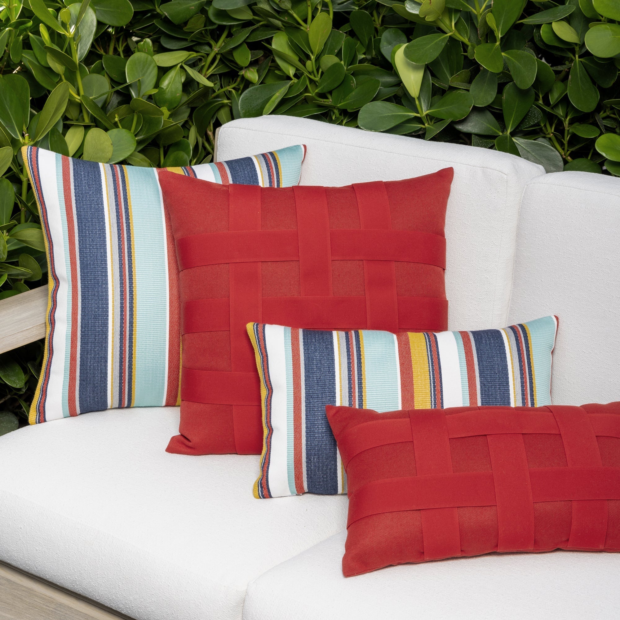 Luxury red classic patterned pillow and floral pillows  on an indoor and outdoor sofa, featuring UV and fade resistant fabric to complete indoor and outdoor decor