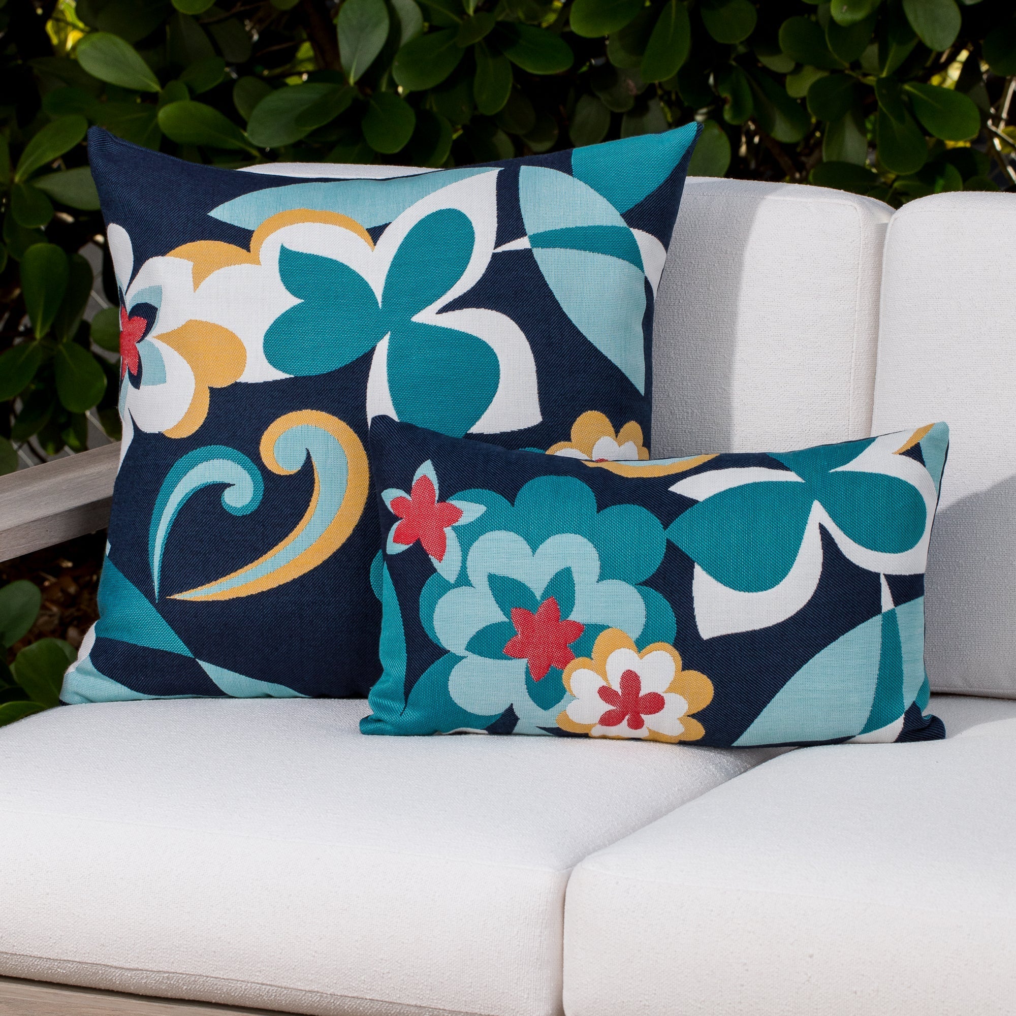 Luxury blue and white textured woven decorative pillow on a outdoor sofa, featuring tailored seams for a polished look to complete indoor and outdoor decor by Elaine Smith