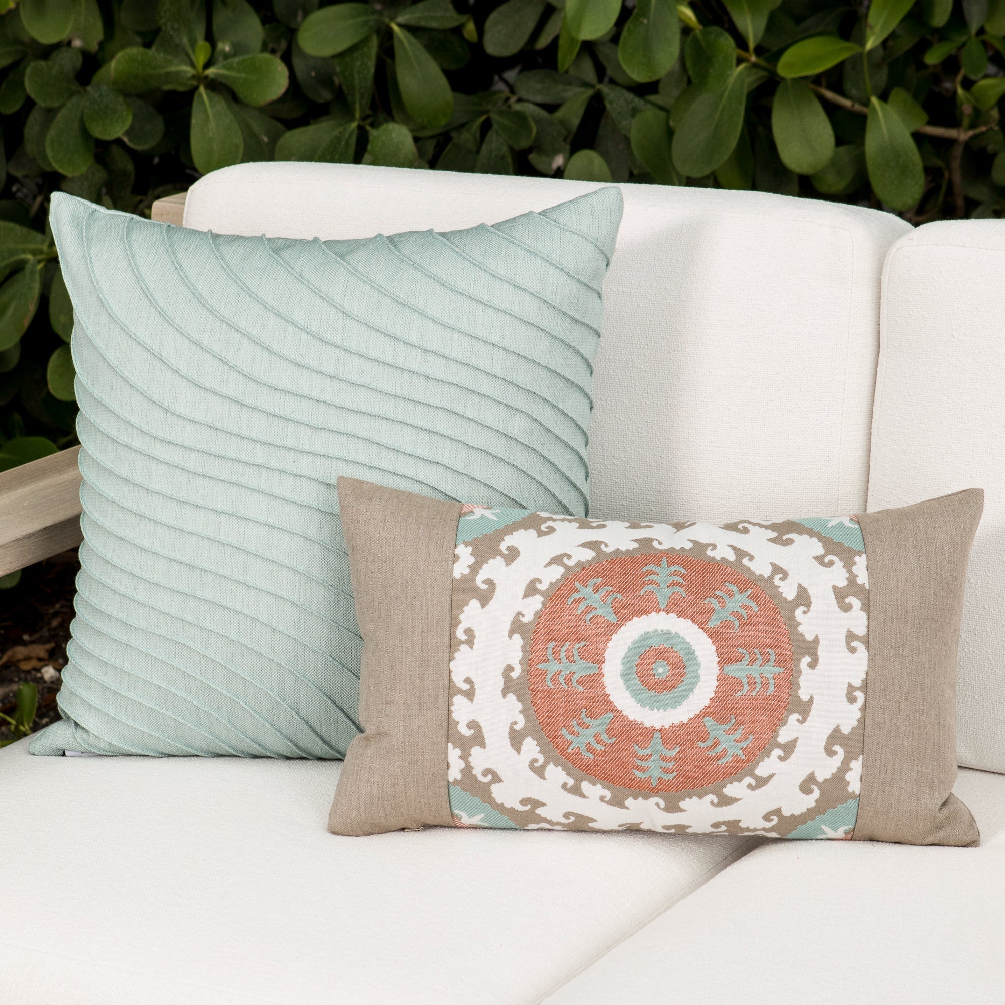 Luxury slate blue subtle patterned decorative pillow on a outdoor sofa styled for hospitality suites, featuring easy clean performance fabric for luxury hotel and resort design by Elaine Smith