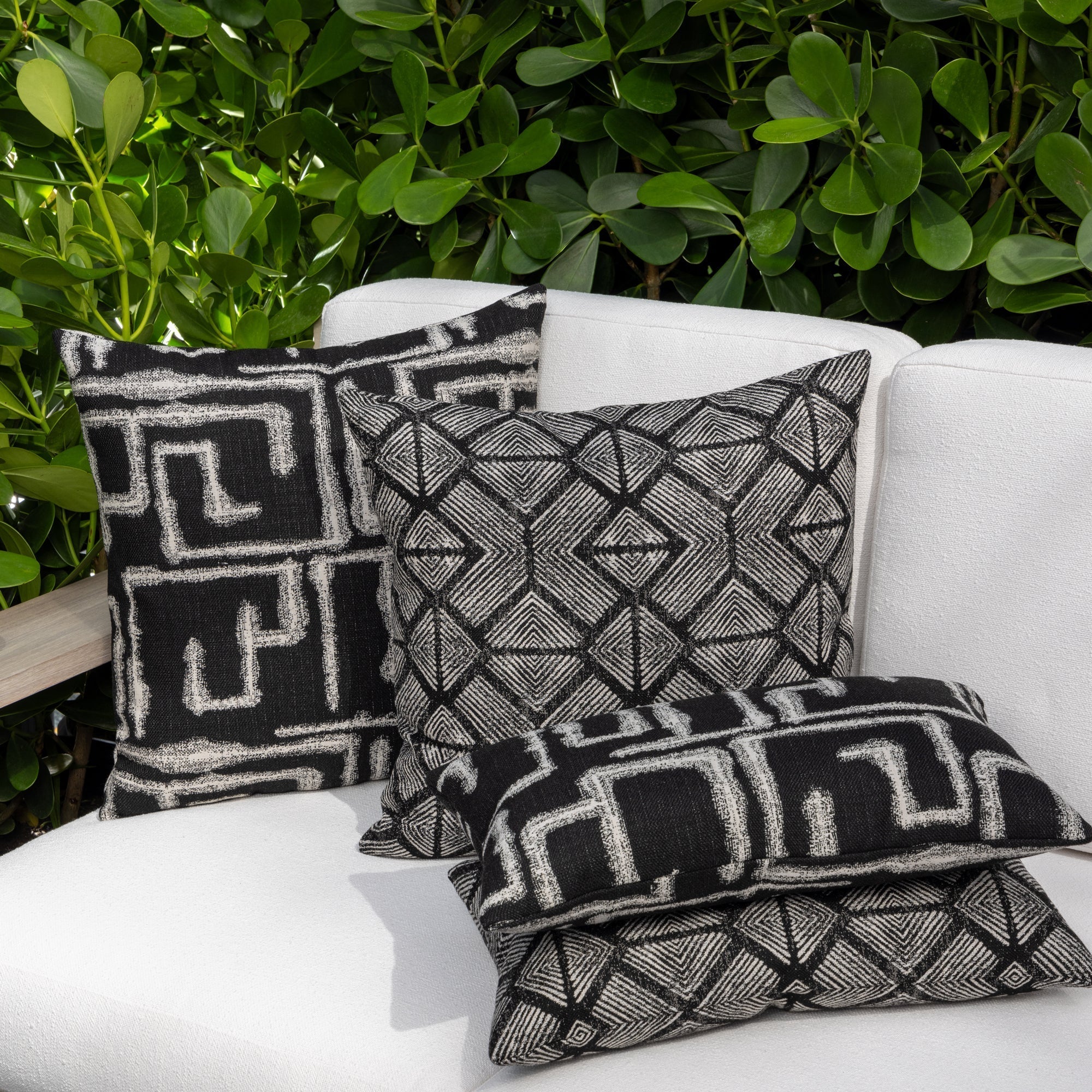 Luxury charcoal classic patterned bolster pillow on a outdoor sofa, featuring plush fill for lasting comfort for hospitality and commercial spaces