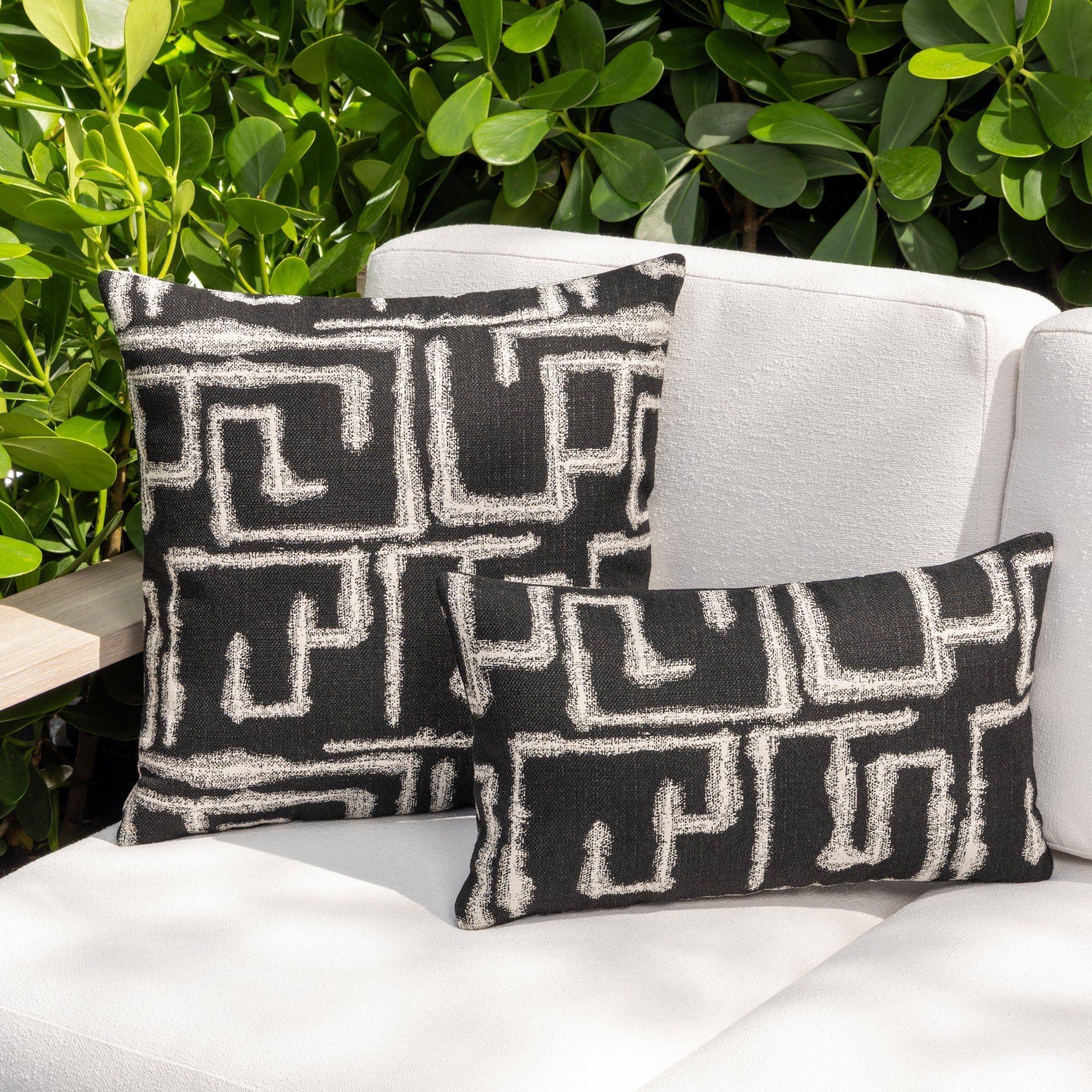 Luxury charcoal classic patterned bolster pillow on a outdoor sofa, featuring plush fill for lasting comfort for hospitality and commercial spaces