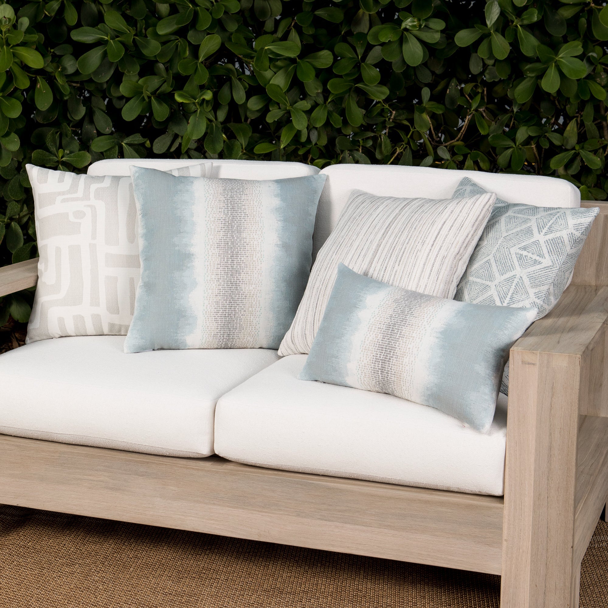 Outdoor image of pillows in Outdoor safe performance fabric with tonal abstract pattern in alabaster white - Noble Alabaster by Elaine Smith