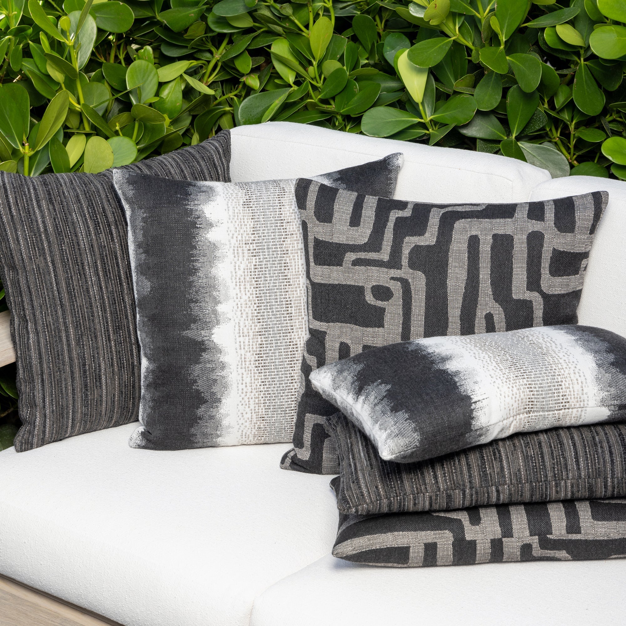 Luxury blue and white textured woven cushions on a outdoor sofa styled for hospitality suites, featuring tailored seams for a polished look to complete indoor and outdoor decor by Elaine Smith
