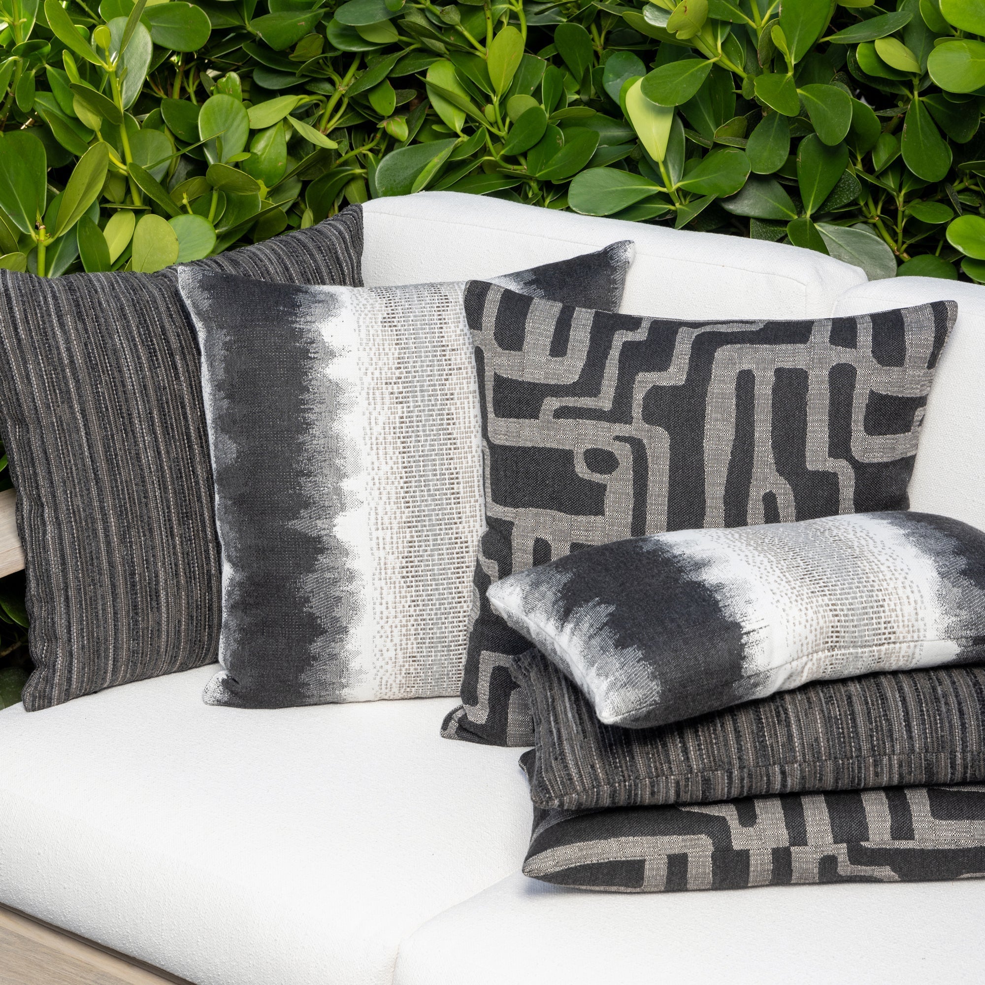 Luxury blue and white textured woven cushions on a outdoor sofa styled for hospitality suites, featuring tailored seams for a polished look to complete indoor and outdoor decor by Elaine Smith