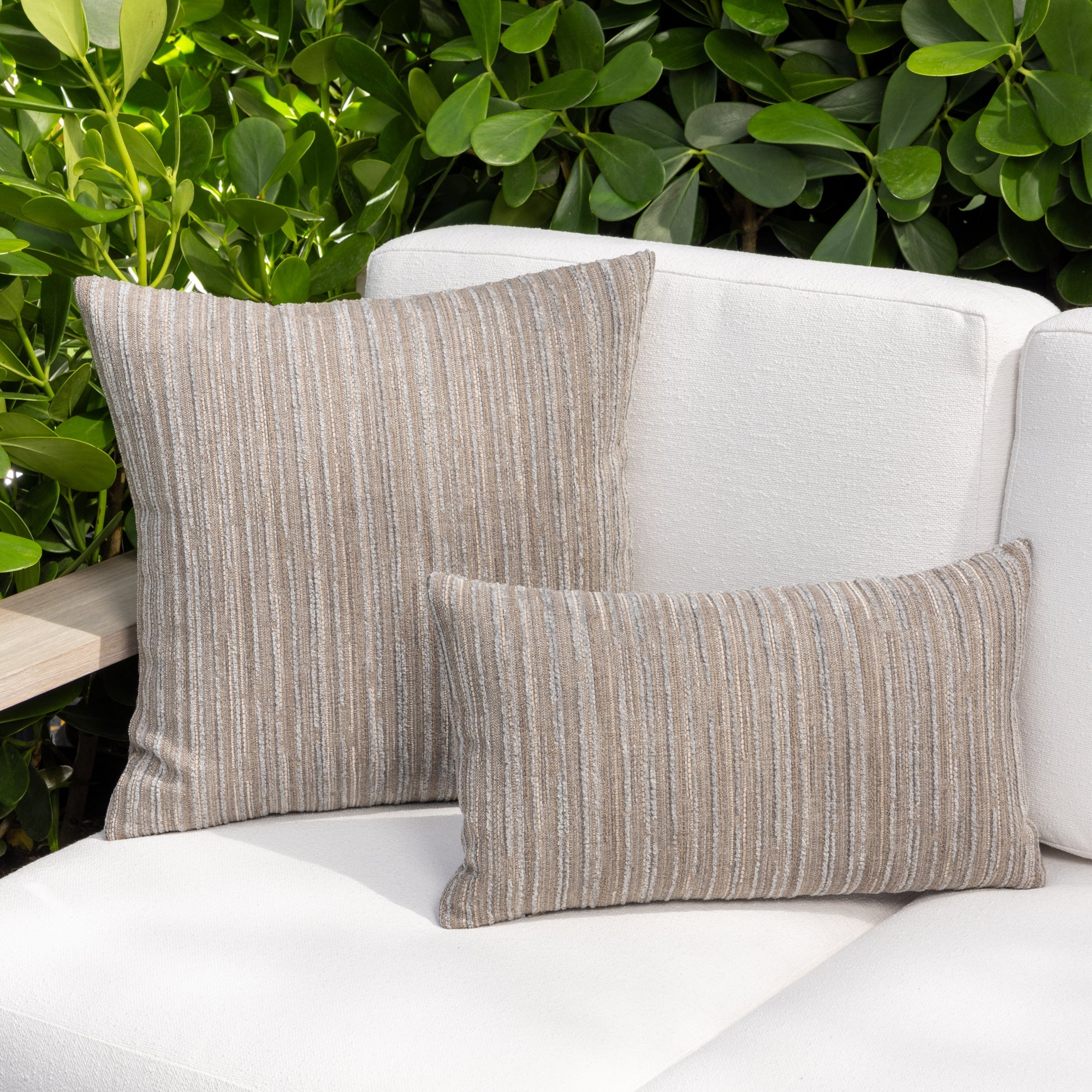 Outdoor image of pillows in Soft pewter stripe outdoor safe performance fabric in cut chenille– Luxe Stripe Pewter by Elaine Smith