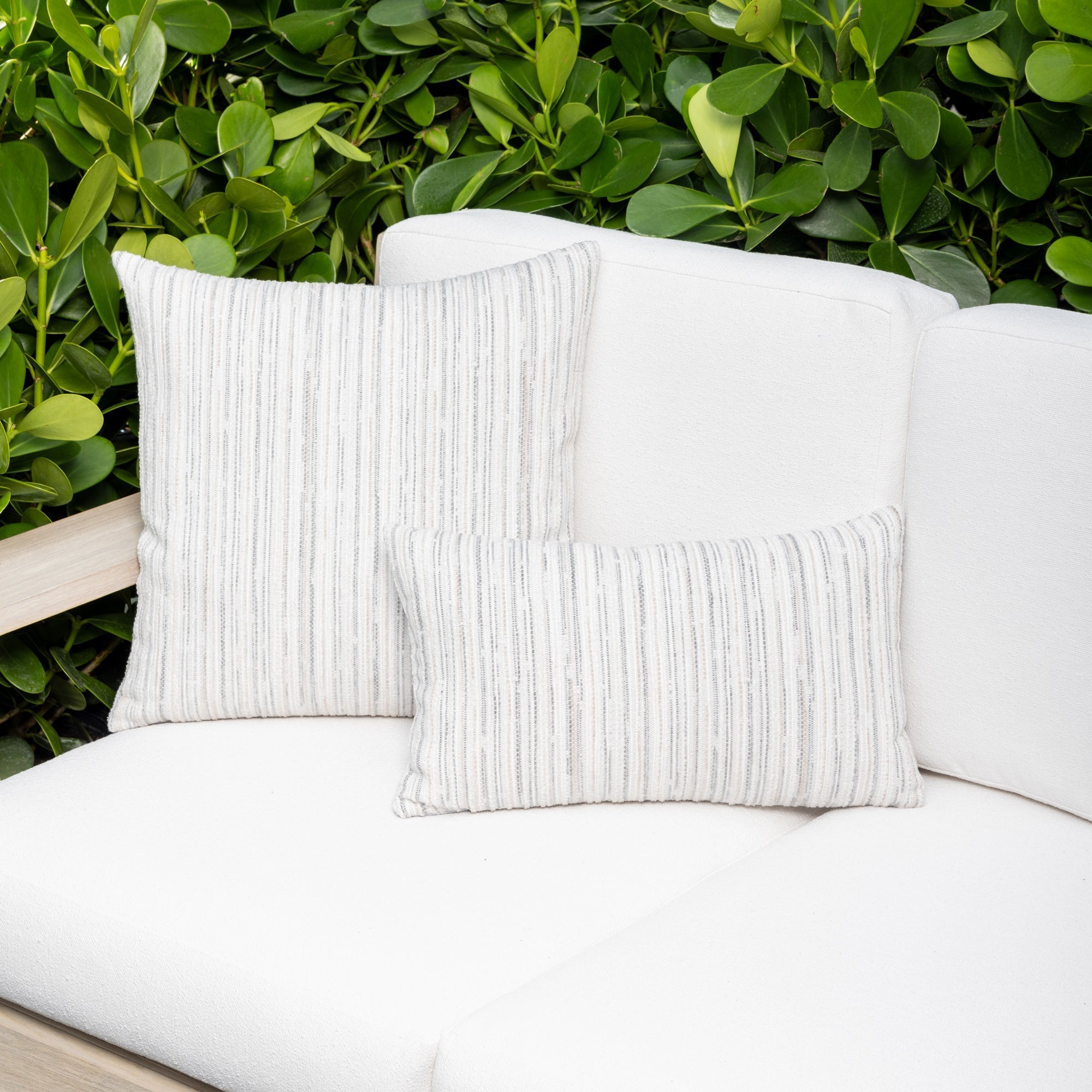 Luxury blue and white textured woven cushions on a outdoor sofa styled for hospitality suites, featuring tailored seams for a polished look to complete indoor and outdoor decor by Elaine Smith