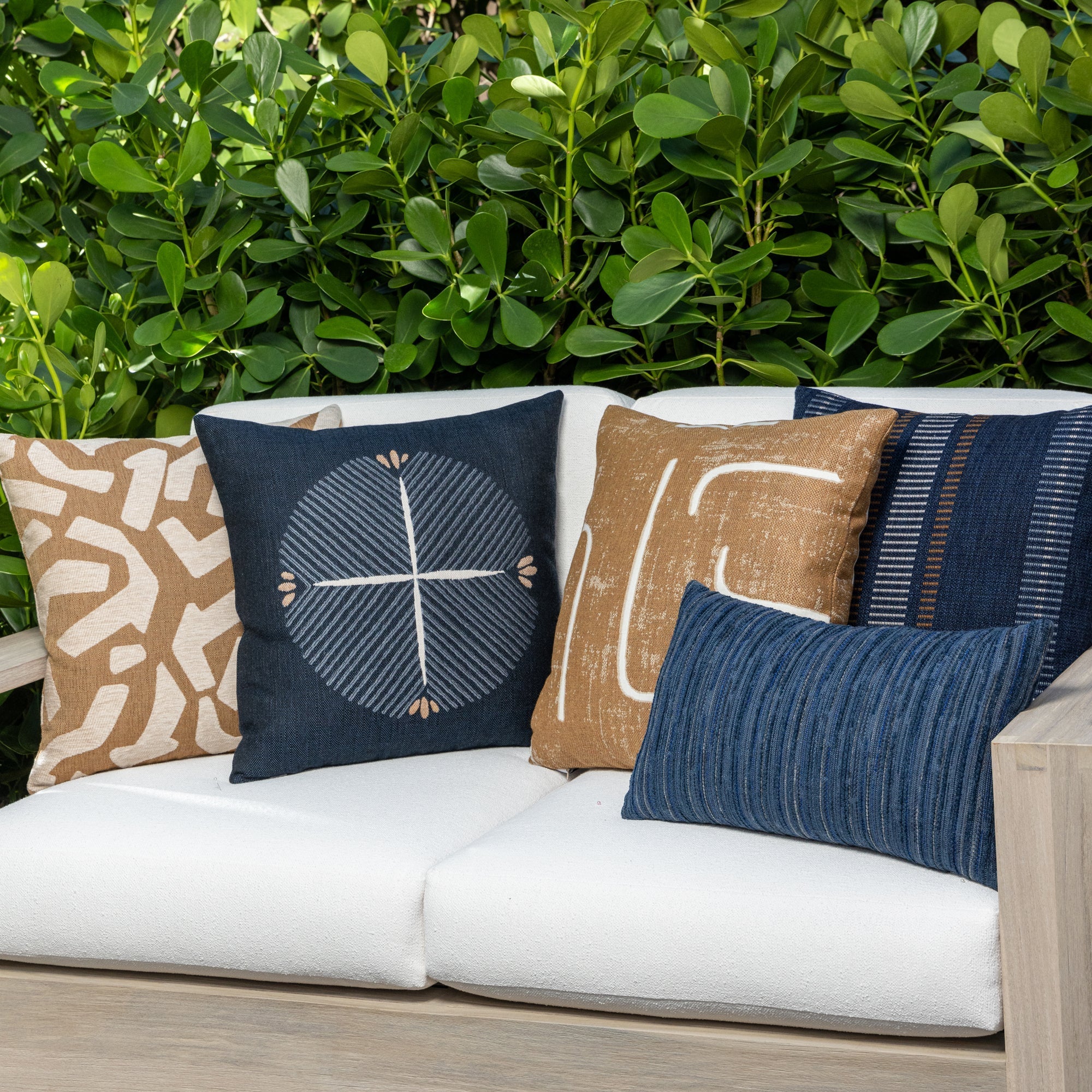 Luxury blue and white textured woven cushions on a outdoor sofa styled for hospitality suites, featuring tailored seams for a polished look to complete indoor and outdoor decor by Elaine Smith