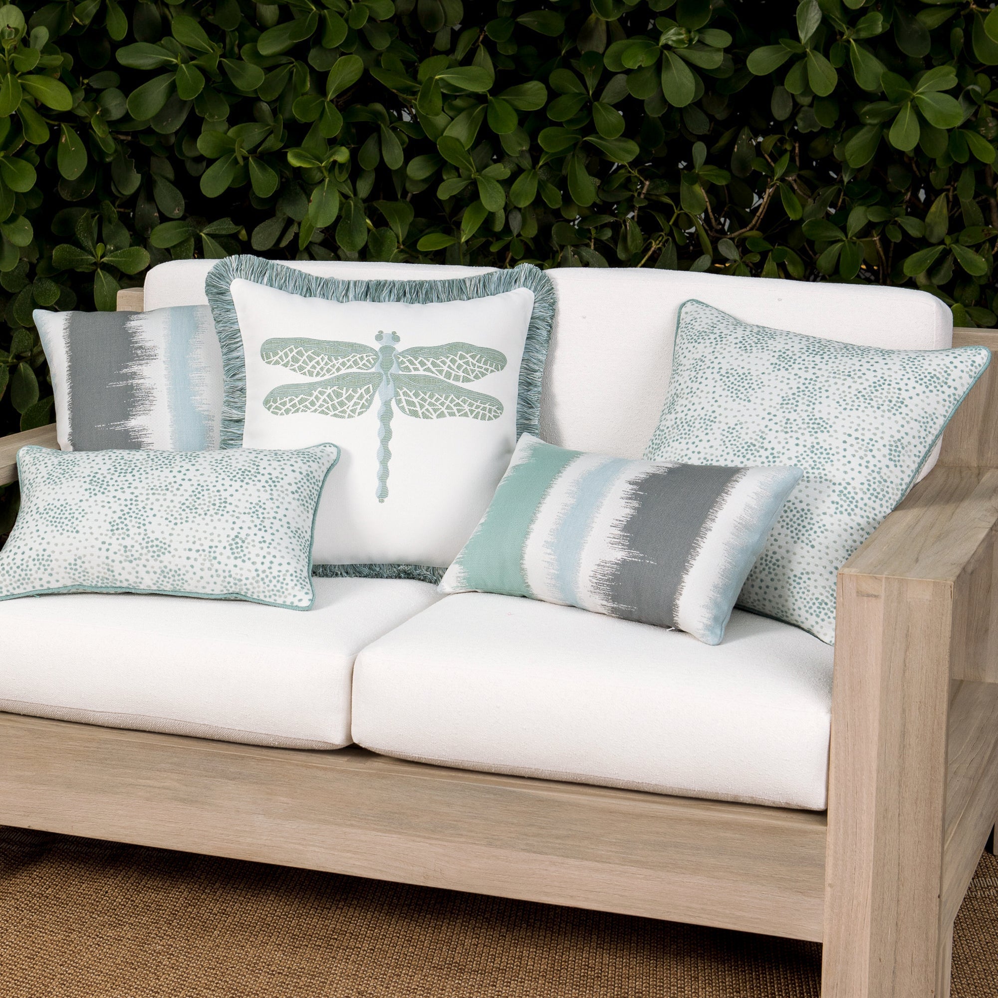 Luxury blue two tone cushion on a rooftop seating area, featuring tailored seams for a polished look to complete indoor and outdoor decor by Elaine Smith