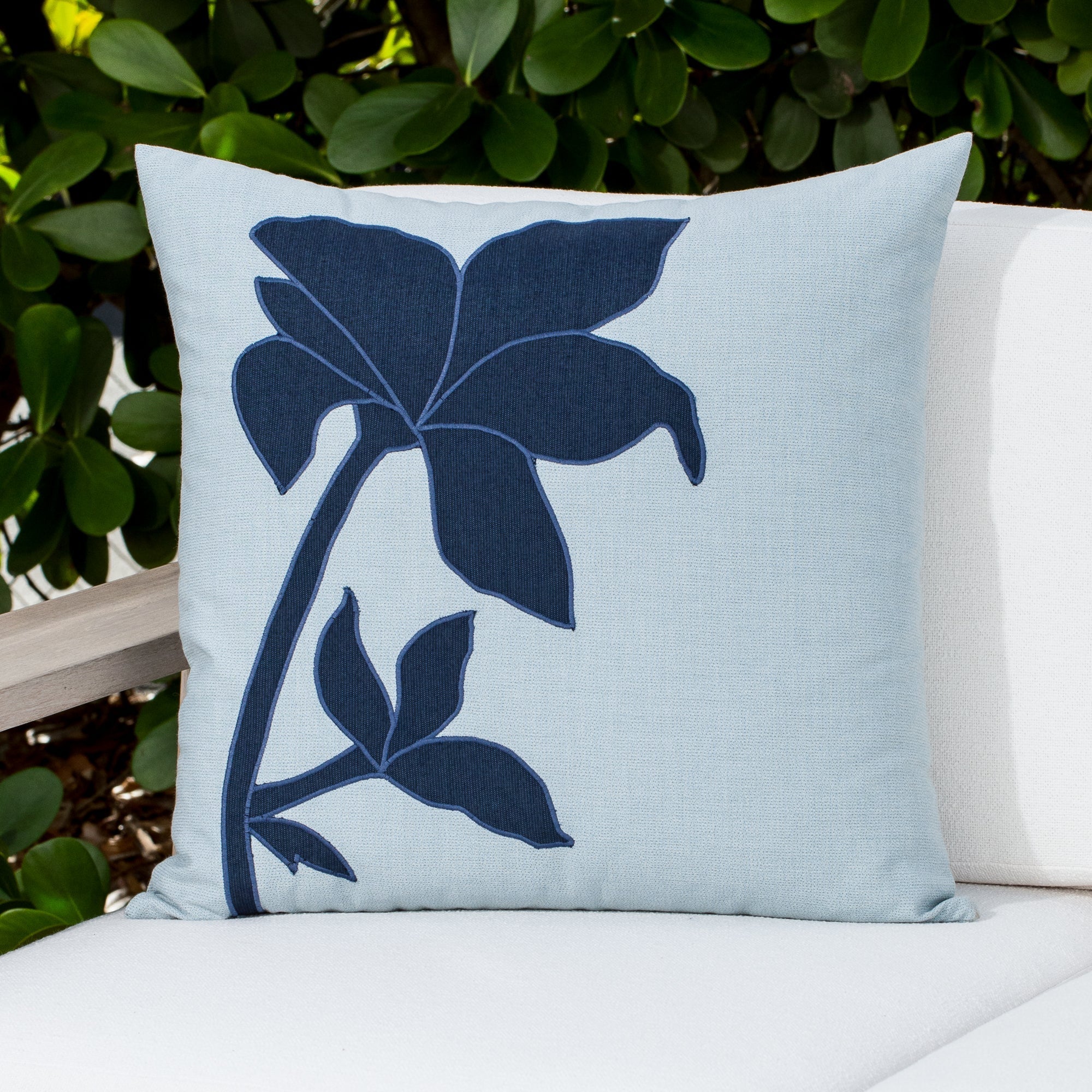 Luxury indigo and gray modern patterned square pillow on a outdoor sofa styled for hospitality suites, featuring solution dyed performance fibers for hospitality and commercial spaces