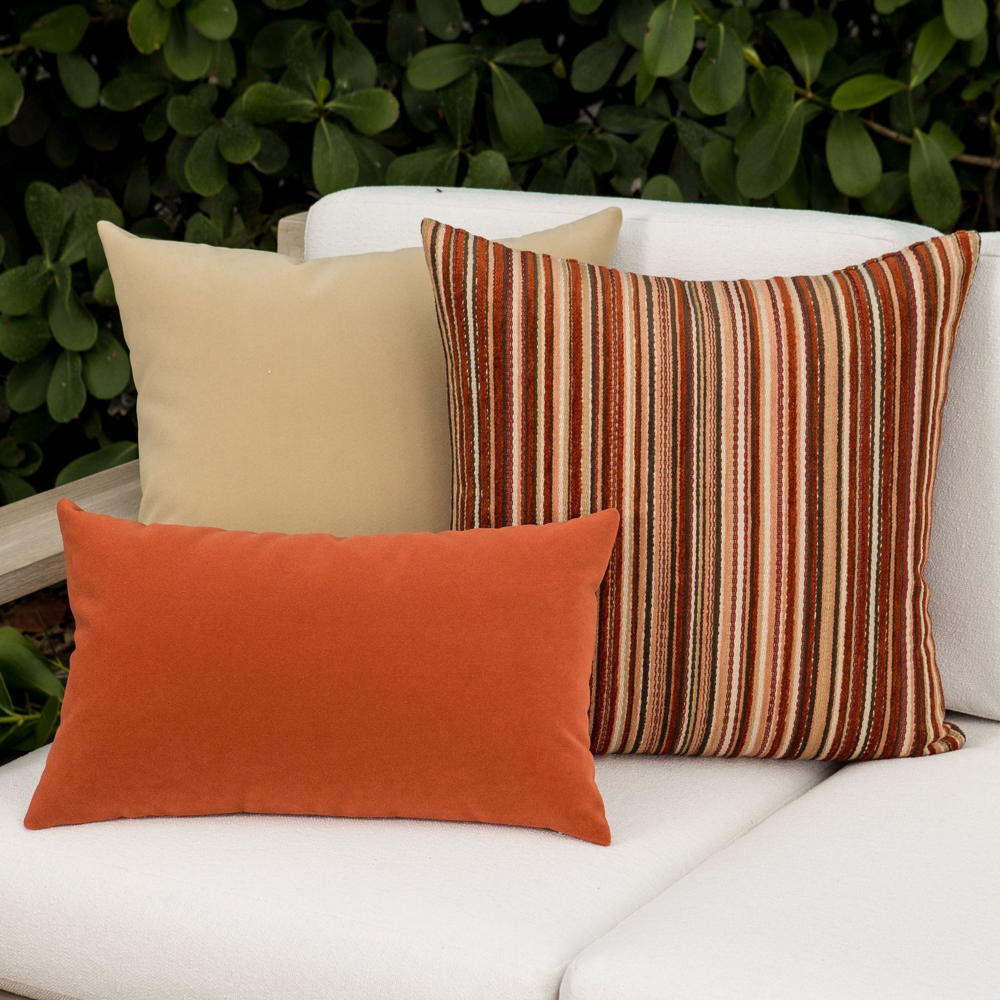 Luxury ouutdoor safe velvet accent cushions on a rooftop seating area, featuring soft touch performance weave for residential and commercial interiors