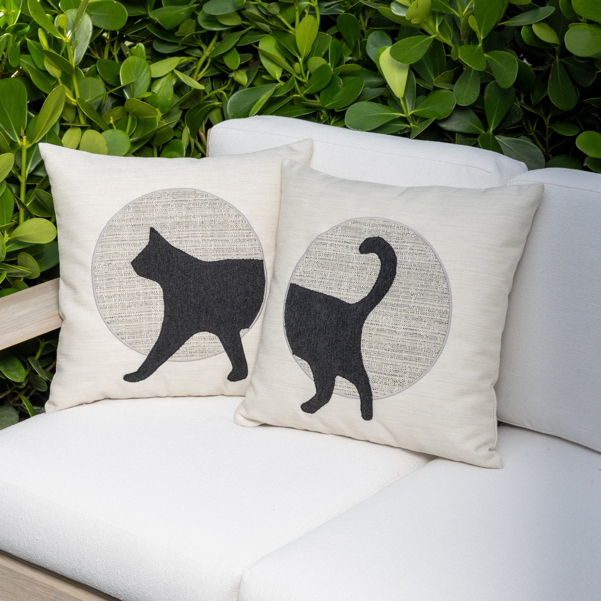 Luxury Cat pillows on an indoor and outdoor sofa, featuring plush fill for lasting comfort for hospitality and commercial spaces