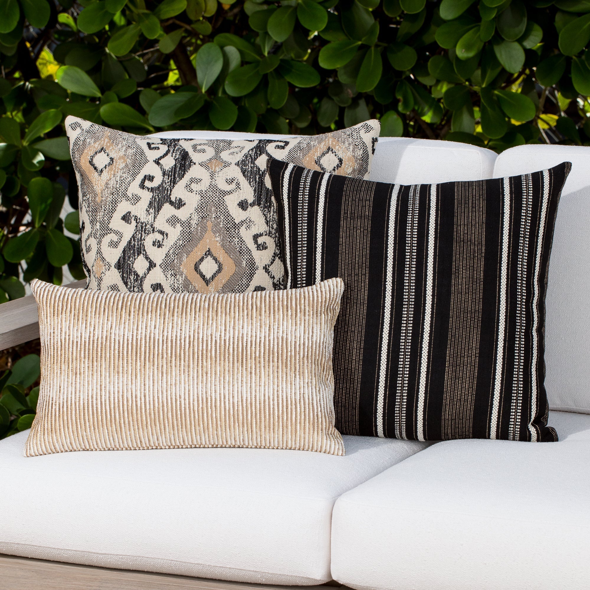 Luxury charcoal two tone cushion on a outdoor sofa, featuring solution dyed performance fibers for hospitality and commercial spaces