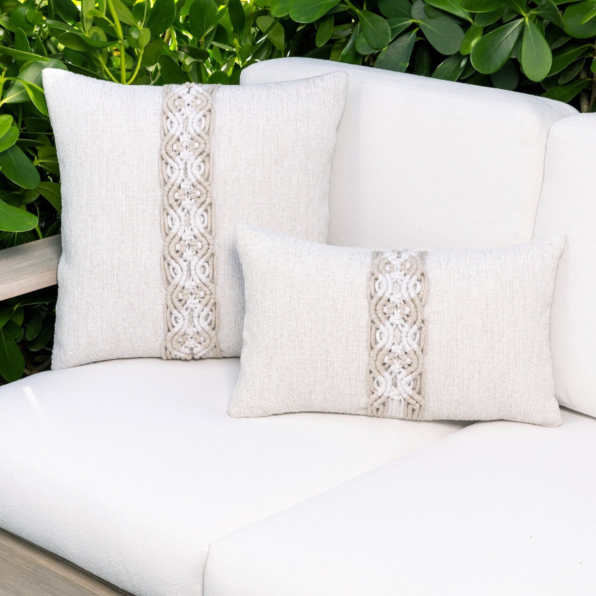 Luxury taupe modern patterned square pillow on a resort cabana dayoutdoor sofa, featuring all weather performance construction for residential and commercial interiors