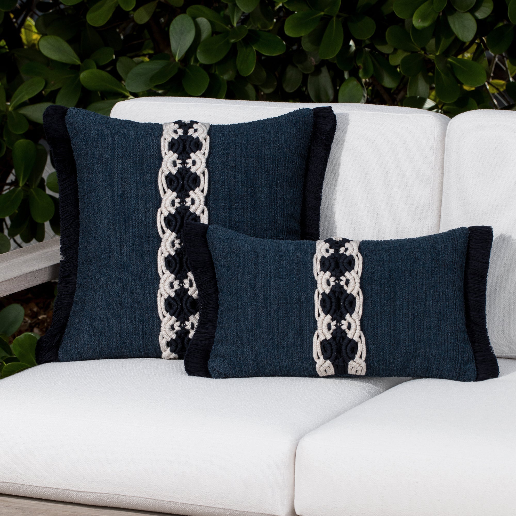 Luxury indigo classic patterned bolster pillow on a rooftop seating area, featuring rich texture for layered decor for indoor and outdoor use