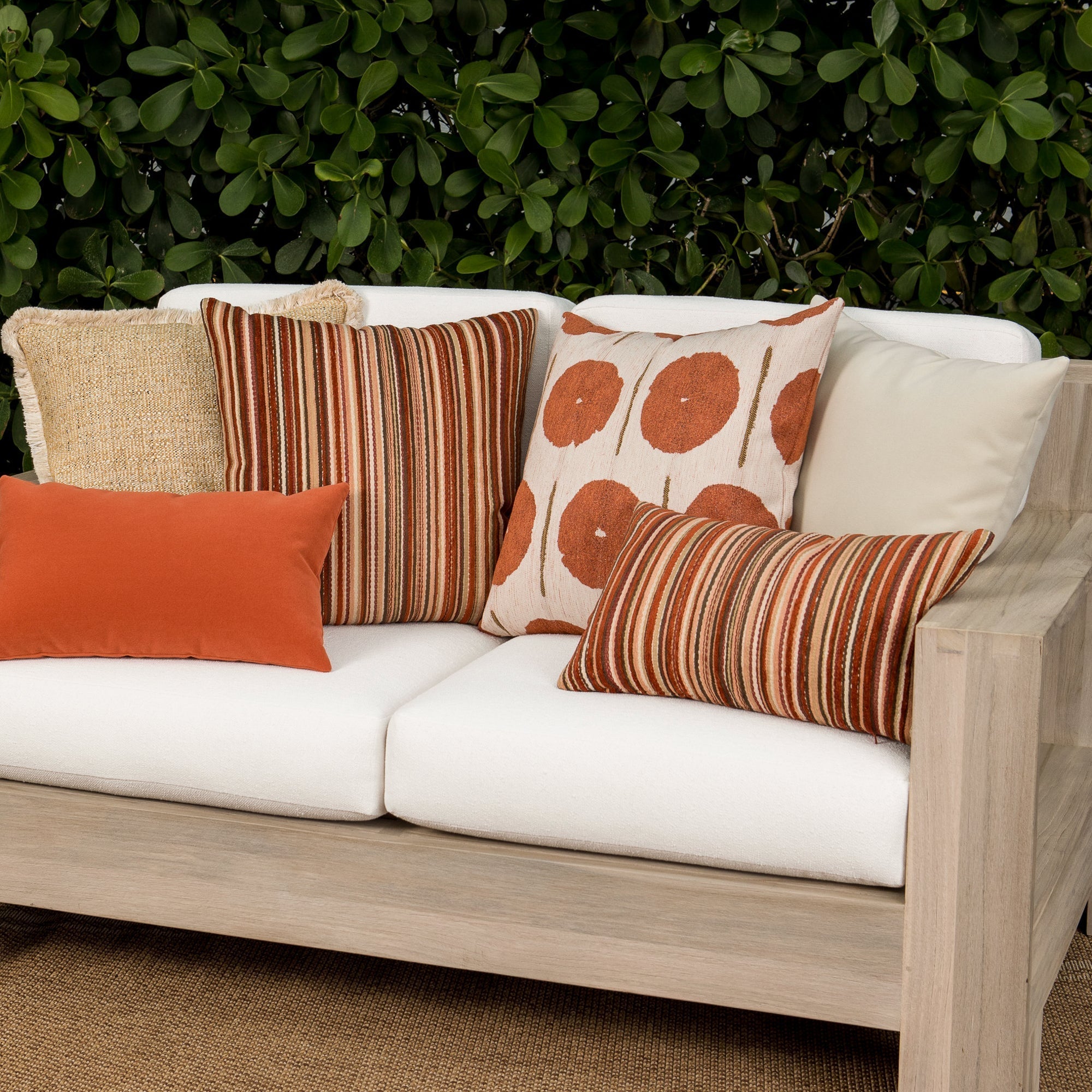 Luxury gold textured woven cushions on a outdoor sofa, featuring all weather performance construction for residential and commercial interiors