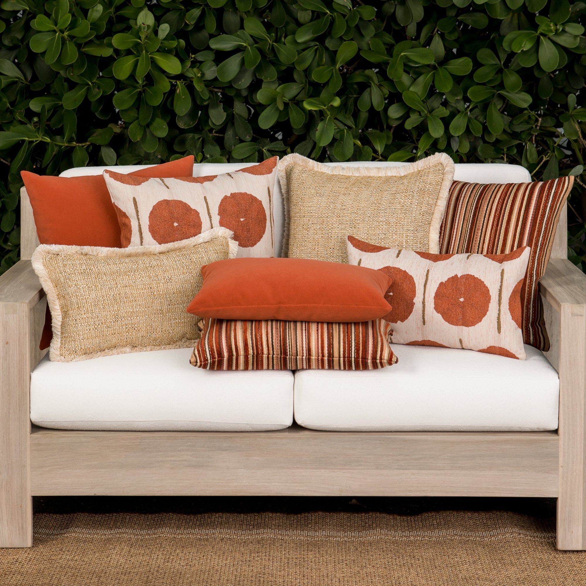 Luxury gold textured woven cushions on a outdoor sofa, featuring all weather performance construction for residential and commercial interiors