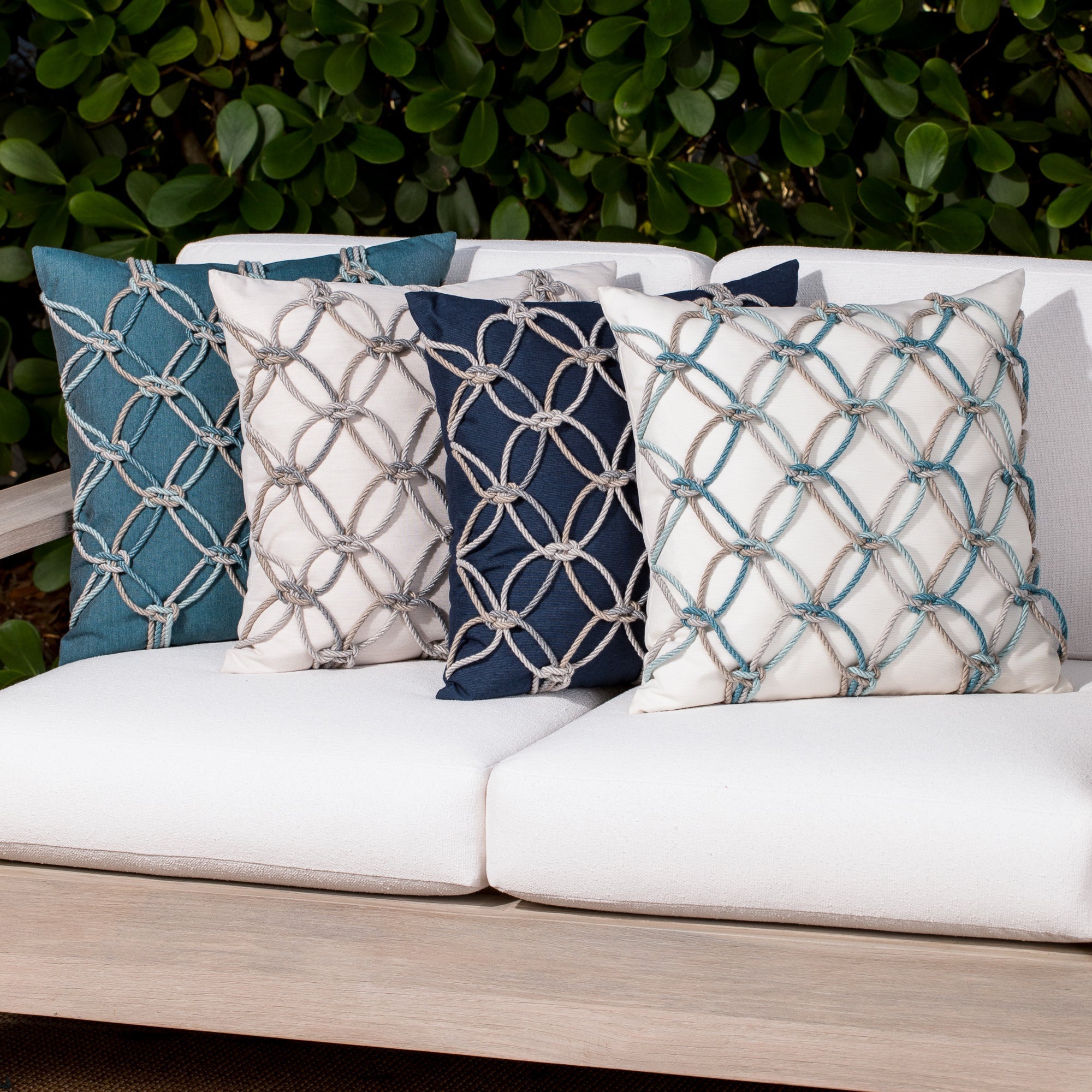 multicolored pillows with hand embelished rope design, safe for outdoor use by Elaine Smith