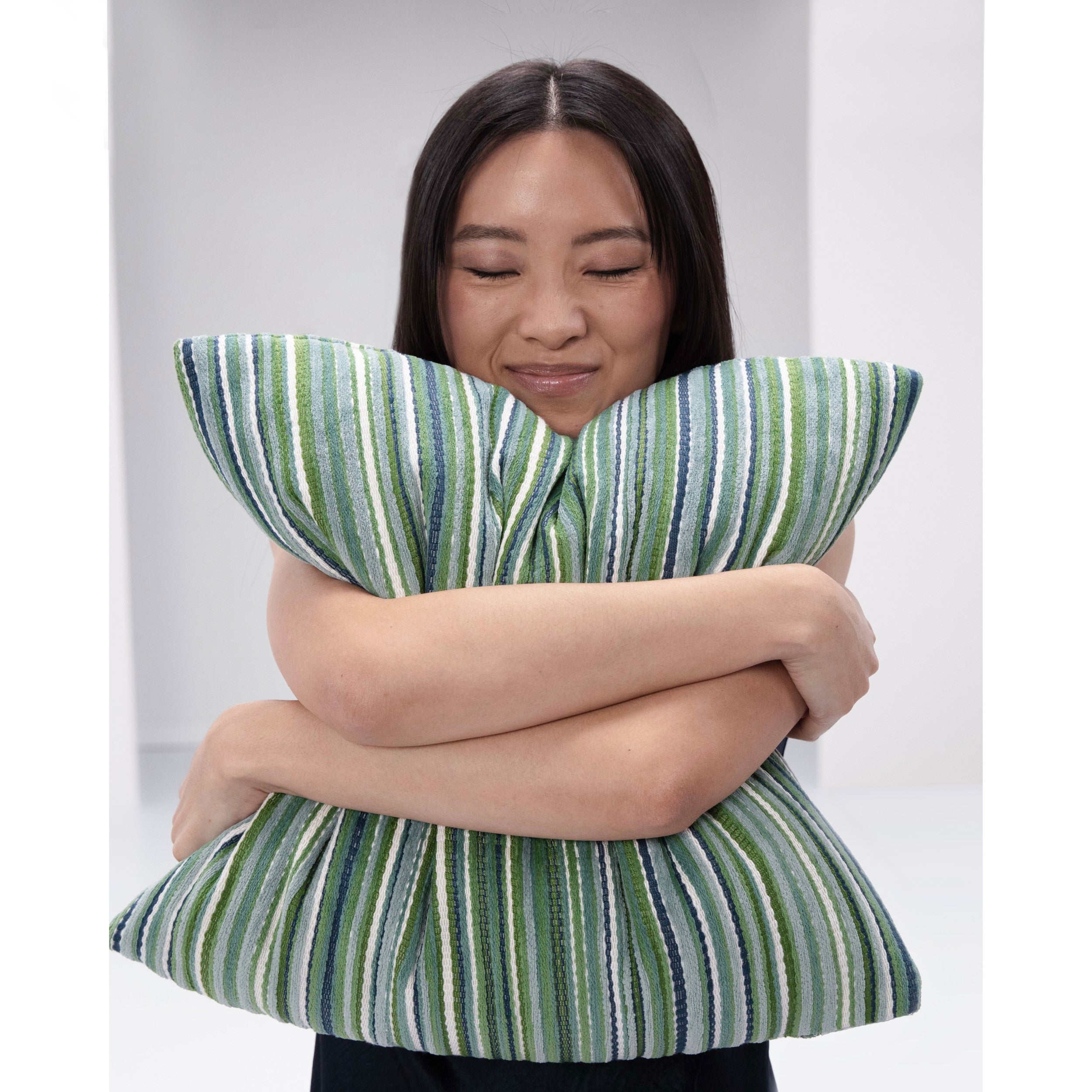 squeezing a lush velvet stripe pillow in green by elaine smith