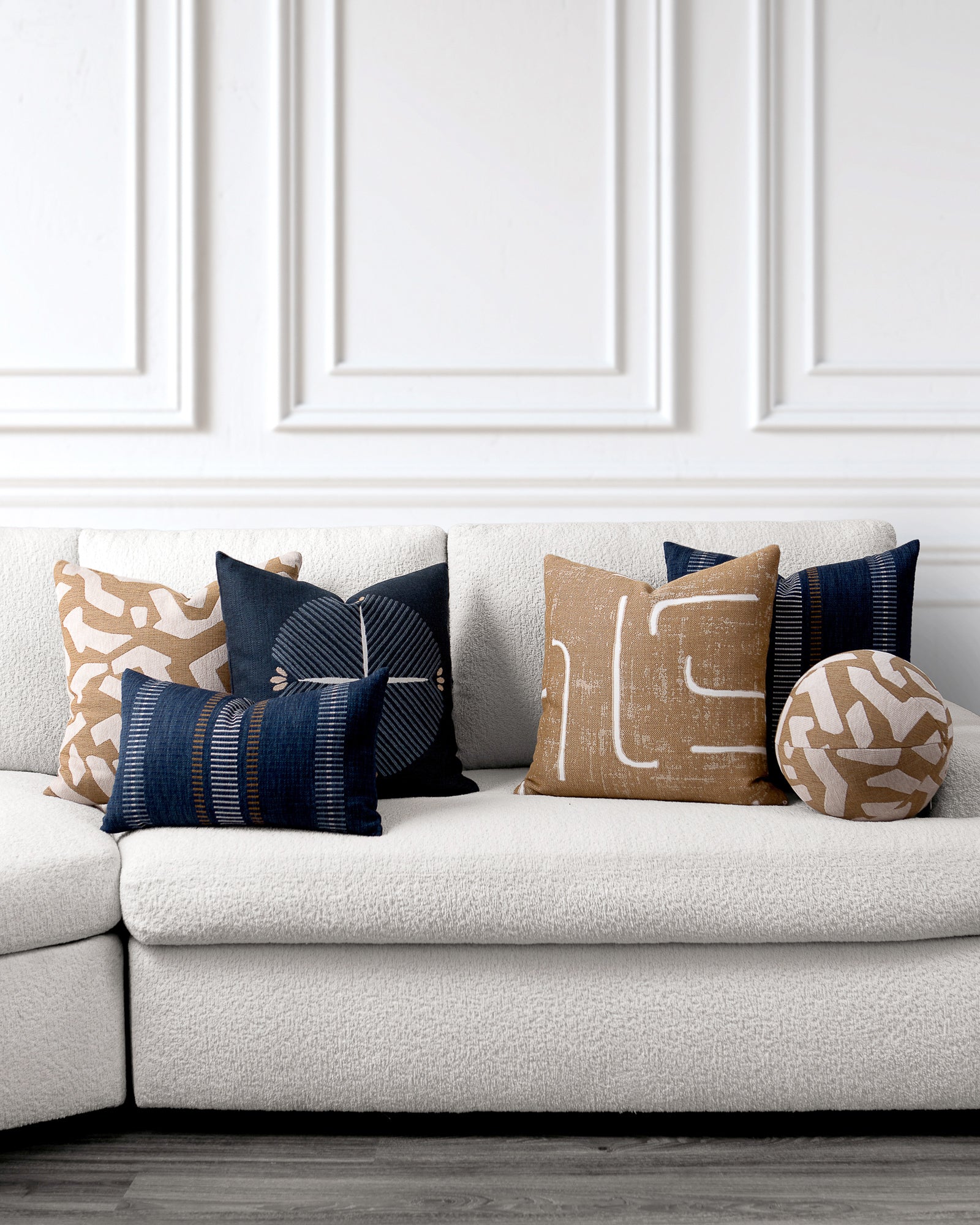 indoor environmental image of caramel and indigo coordinated pillow group by Elaine 