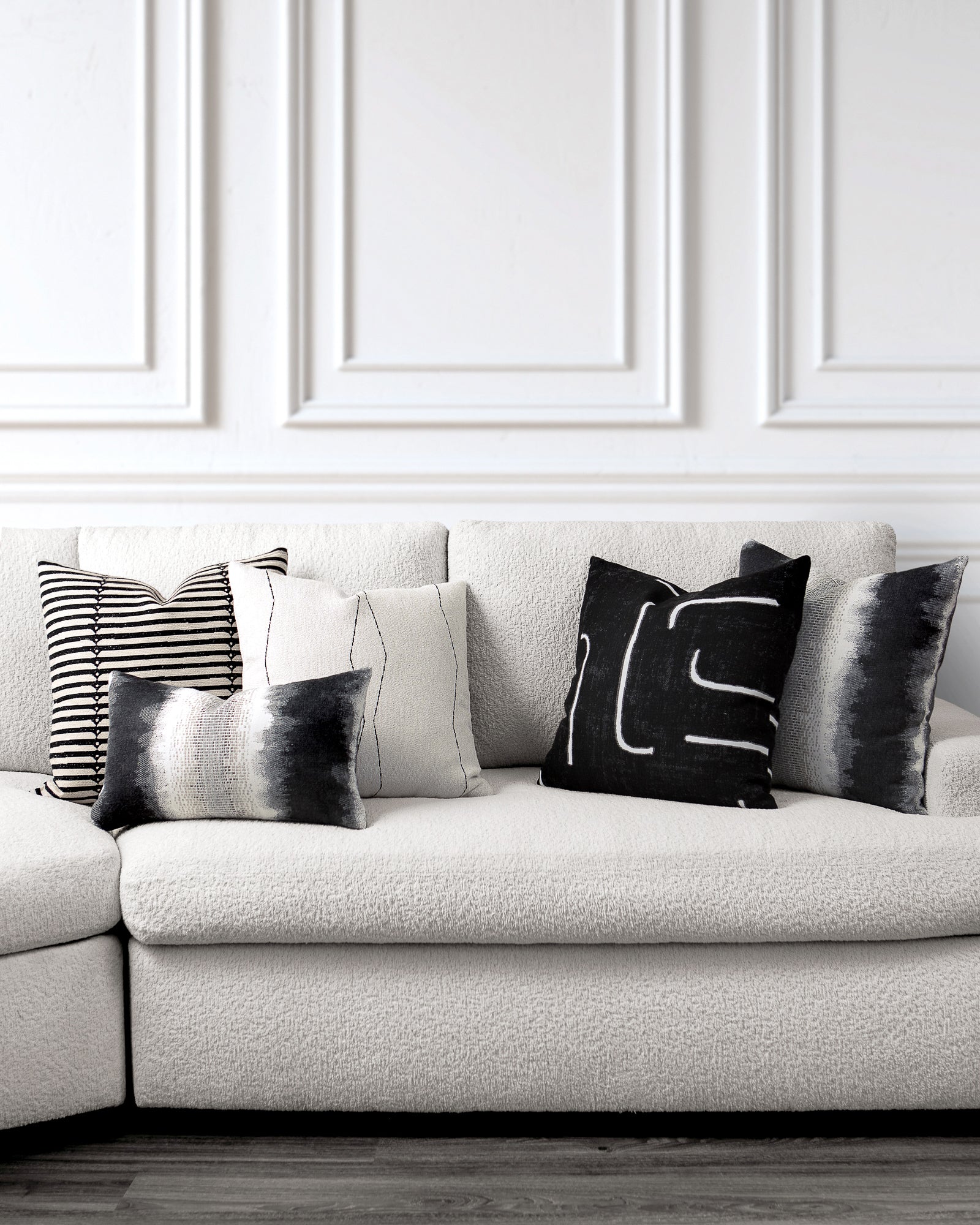 indoor environmental image of charcoal and ivory coordinated pillow group by Elaine 