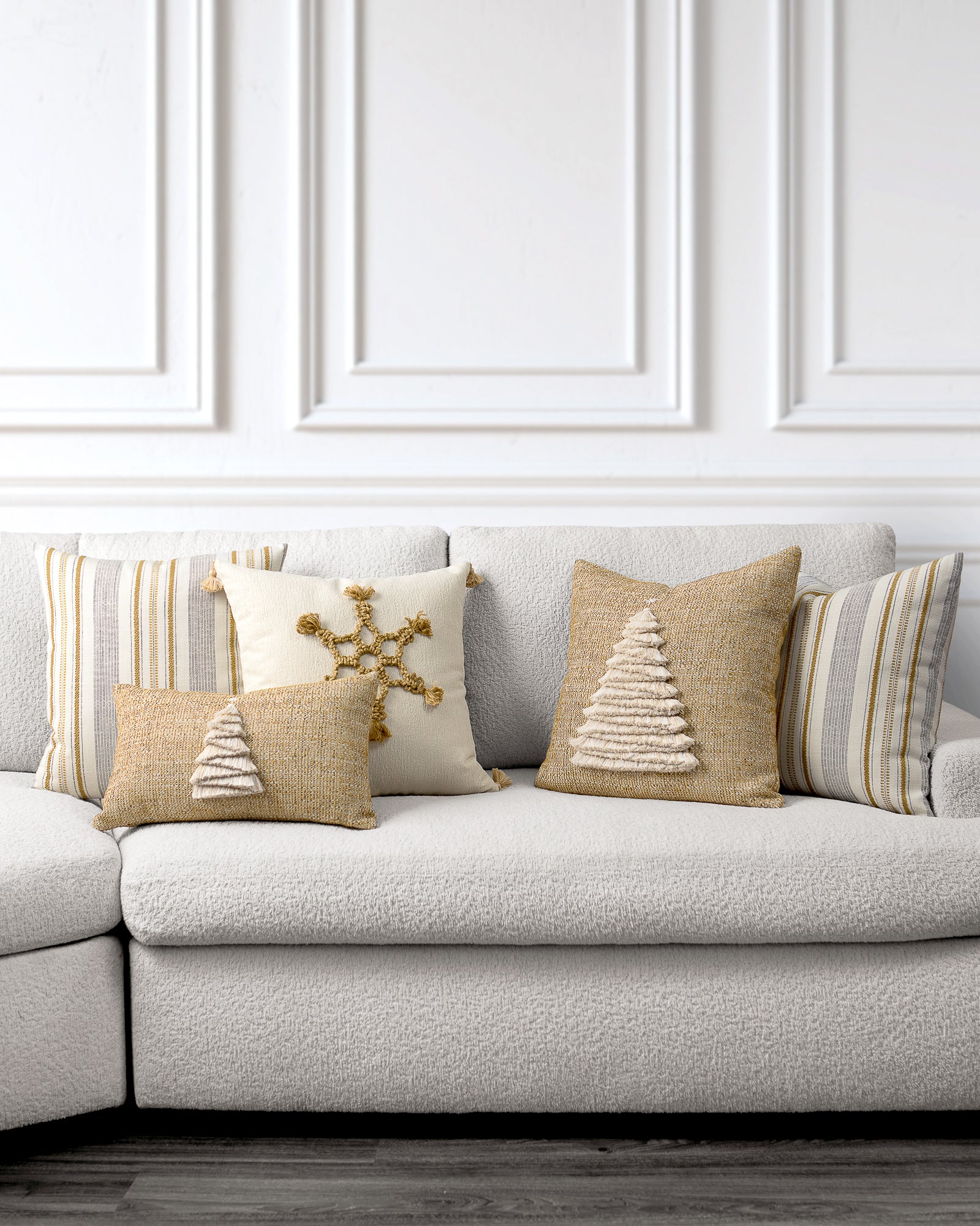indoor environmental image of gold and ivory gilded holiday pillow group by Elaine Smith