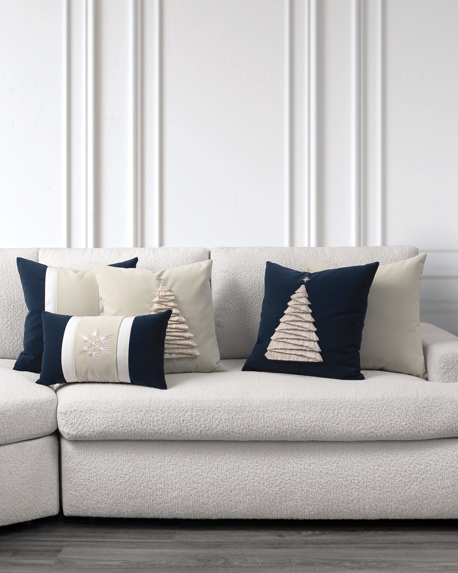 indoor environmental image of dark blue and ivory starlight holiday pillow group by Elaine Smith