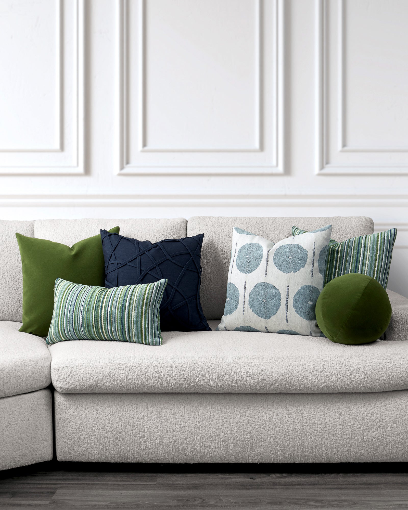 indoor environmental image of green light blue and indigo velvet nature pillow group by Elaine Smith