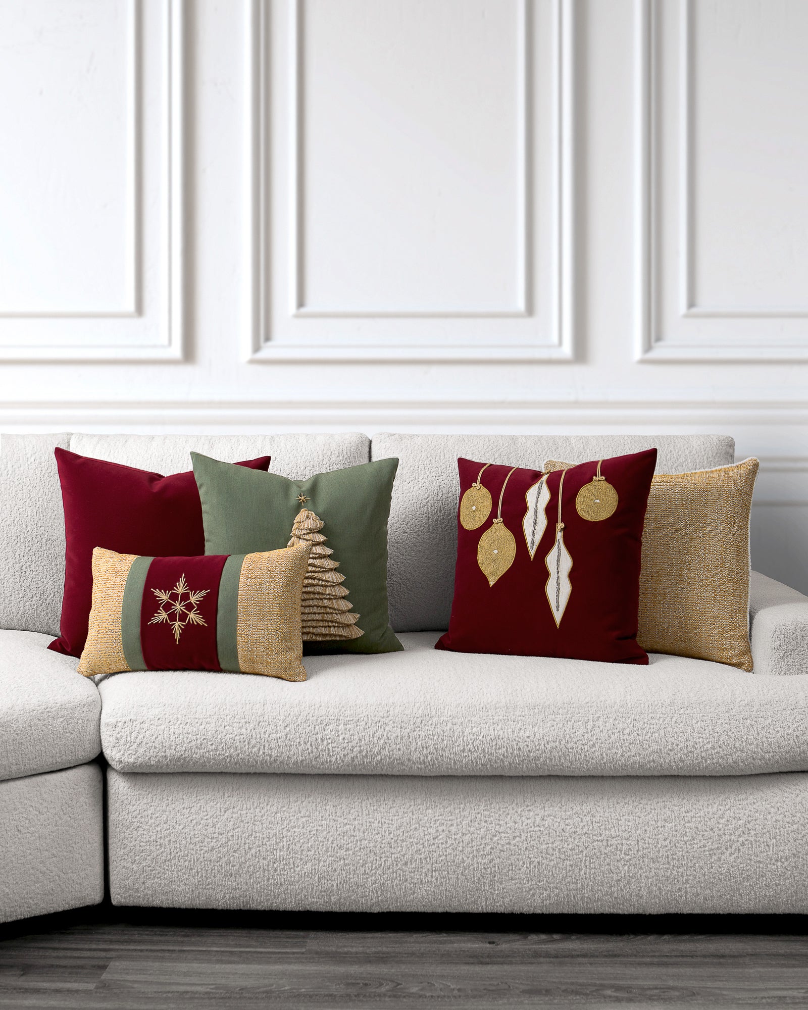 indoor environmental image of red green and gold noel holiday pillow group by Elaine Smith
