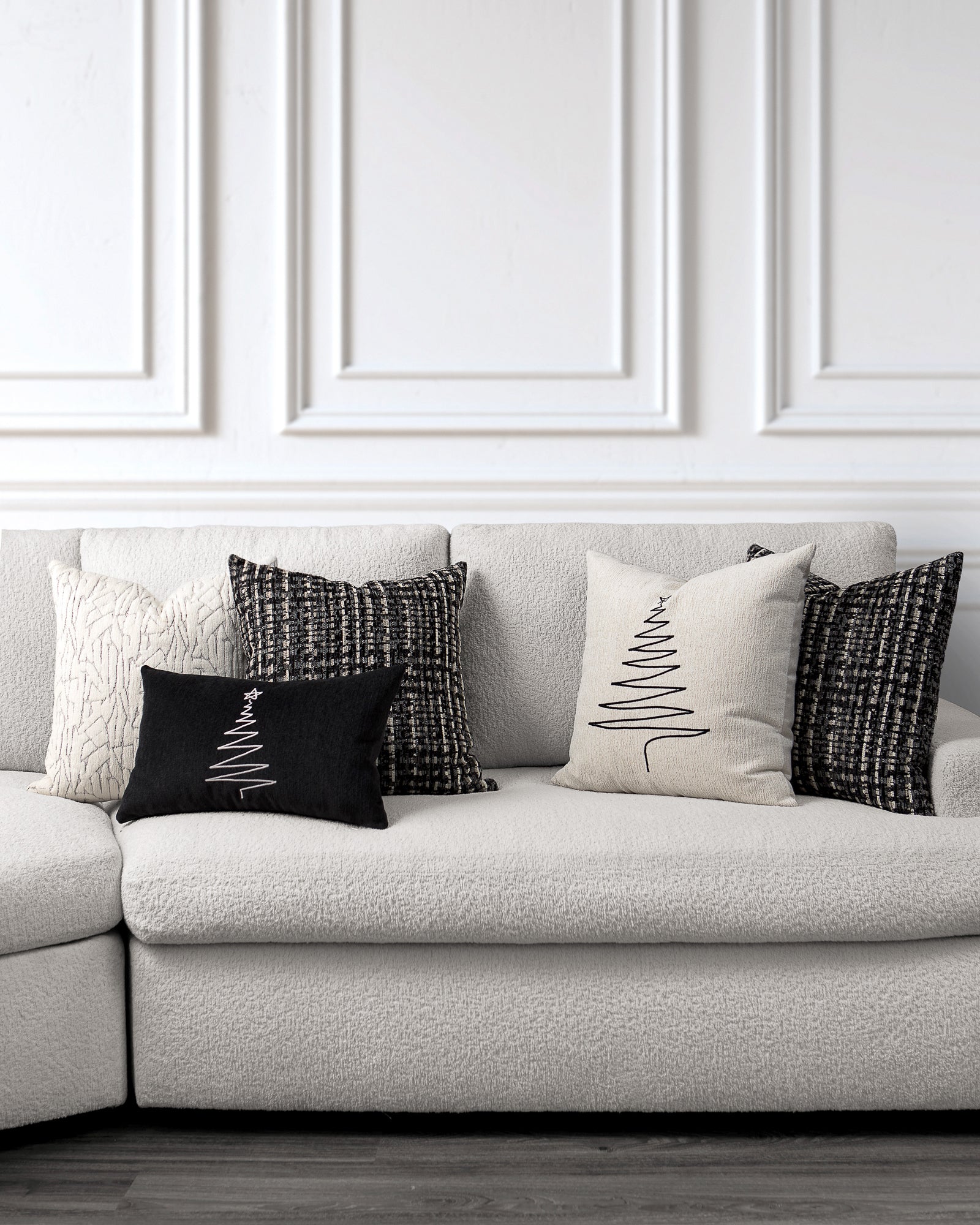 indoor environmental image of black and cream tuxedo holiday pillow group by Elaine Smith