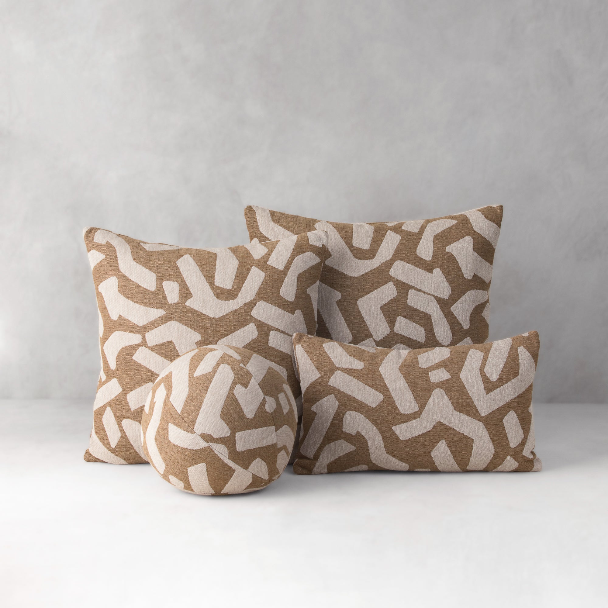 Set of four patterned pillows on a neutral background- outdoor safe by Elaine Smith