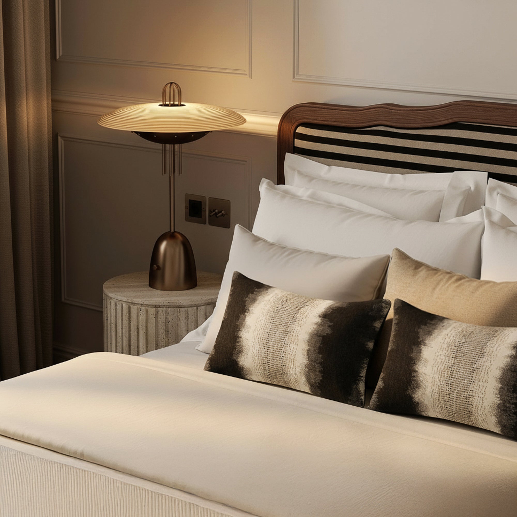 ombre striped lumbar pillows in charcoal gray on bed
