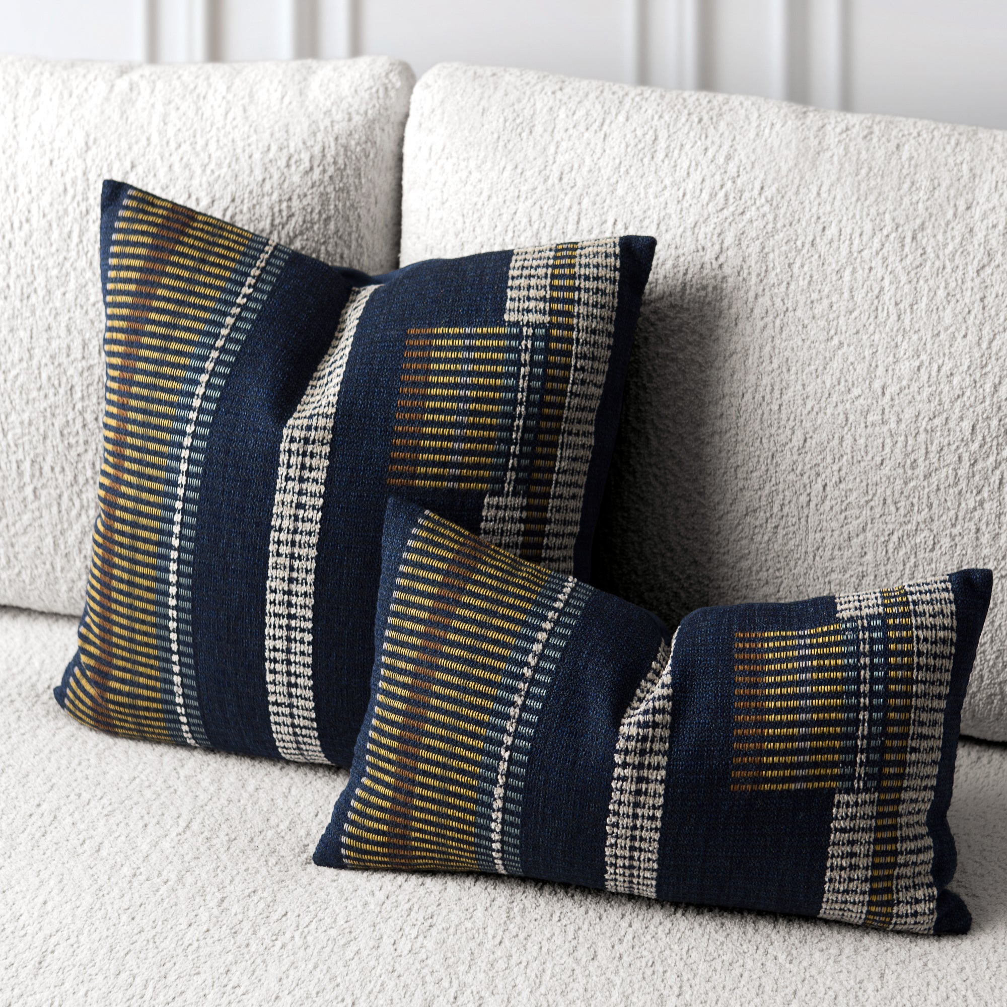 Patterned cushions on a textured sofa