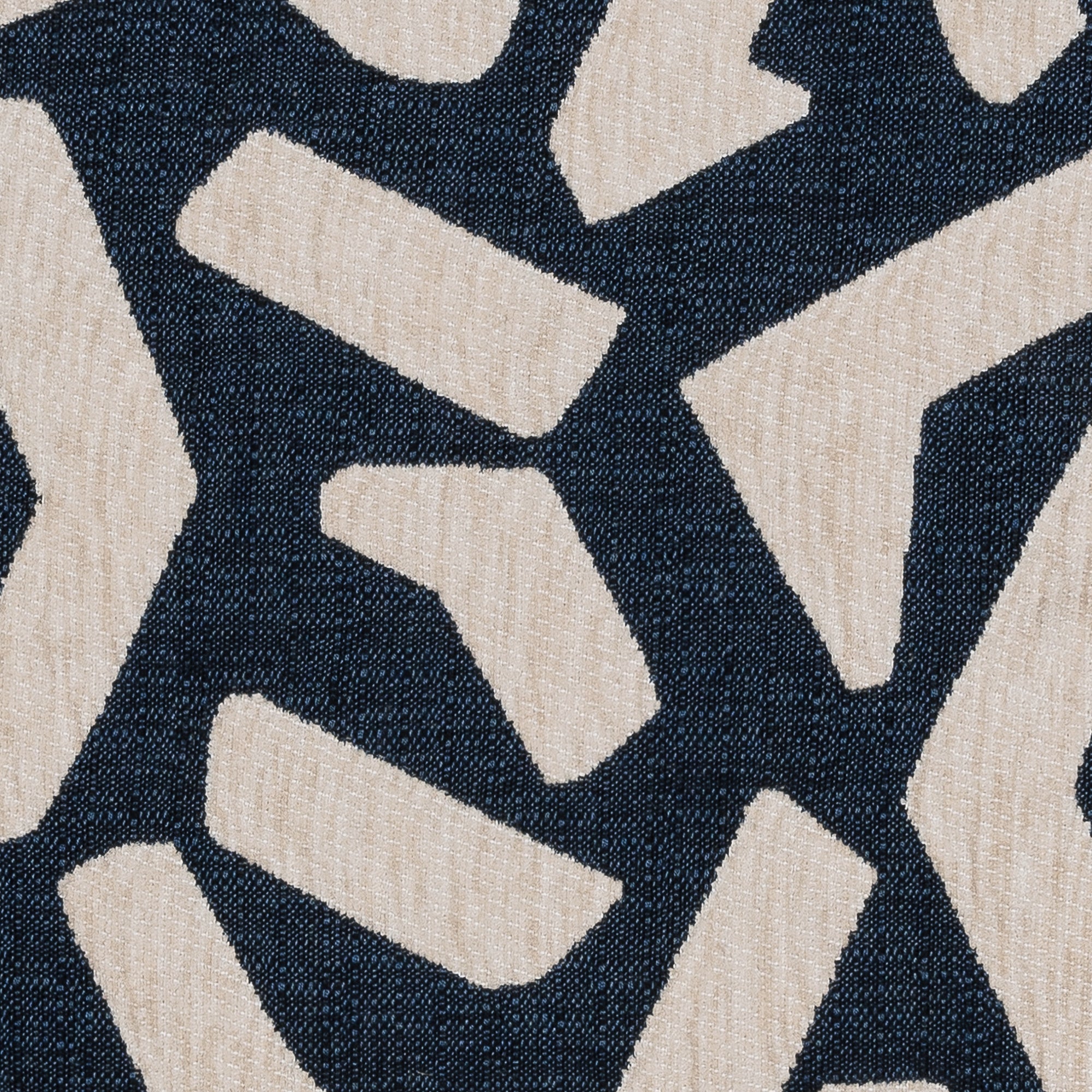 Detail image of Abstract indigo outdoor safe fabric with geometric shapes in flax chenille