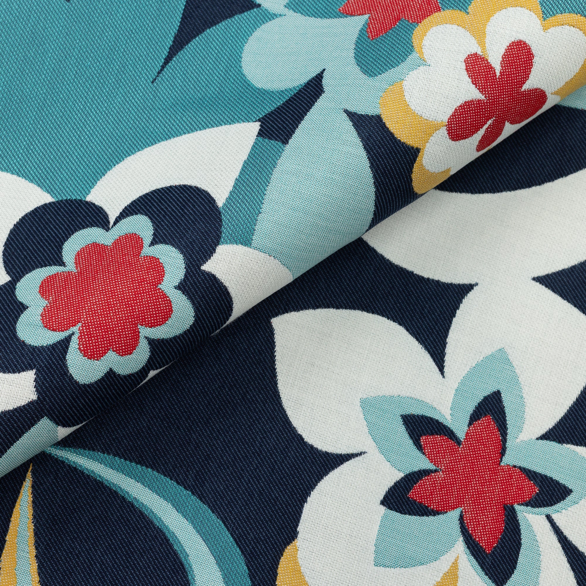 Close shot texture image of Bold floral outdoor safe fabric with white, red, and navy blue blooms