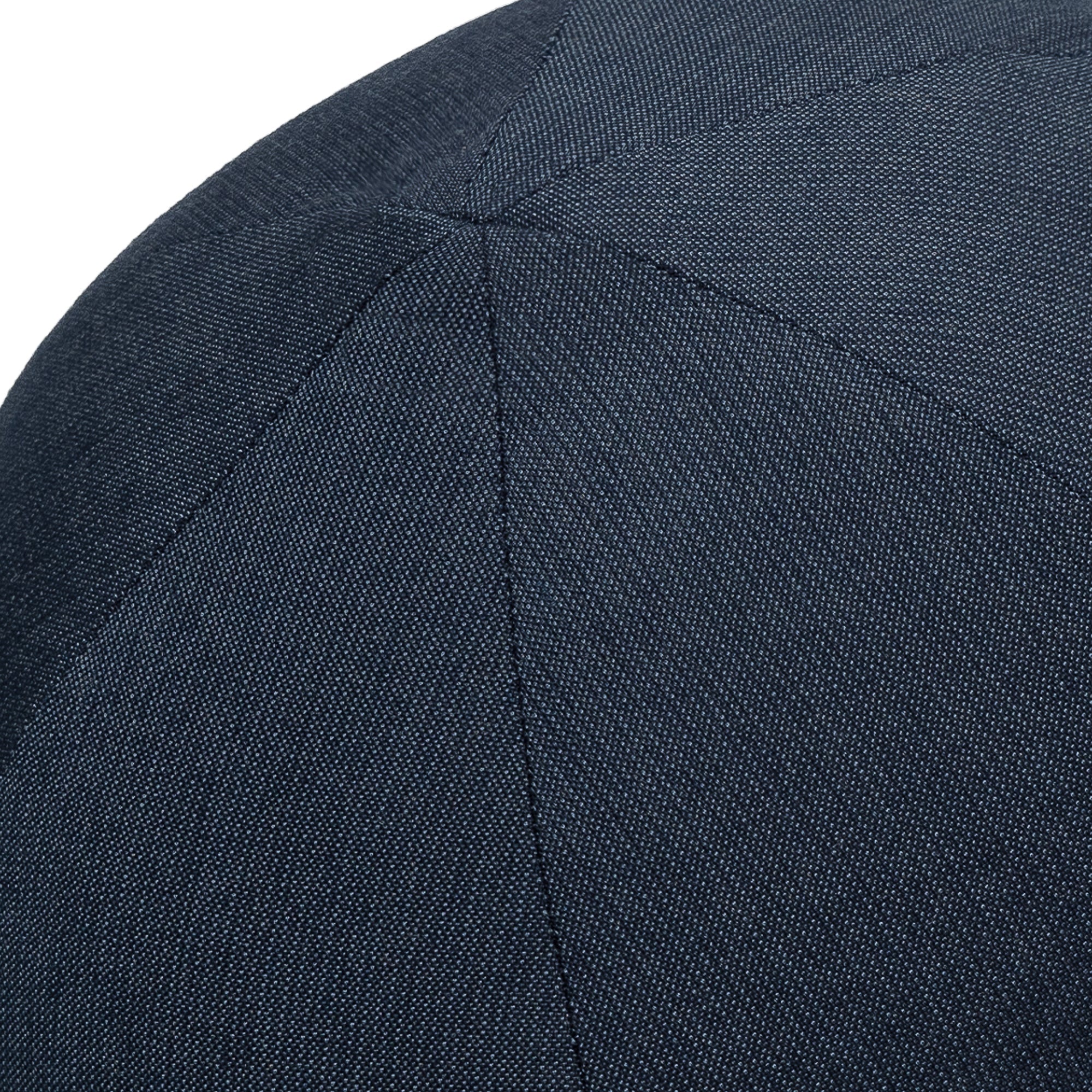 Detail image of Round navy outdoor pillow with textured finish for stylish patio decor