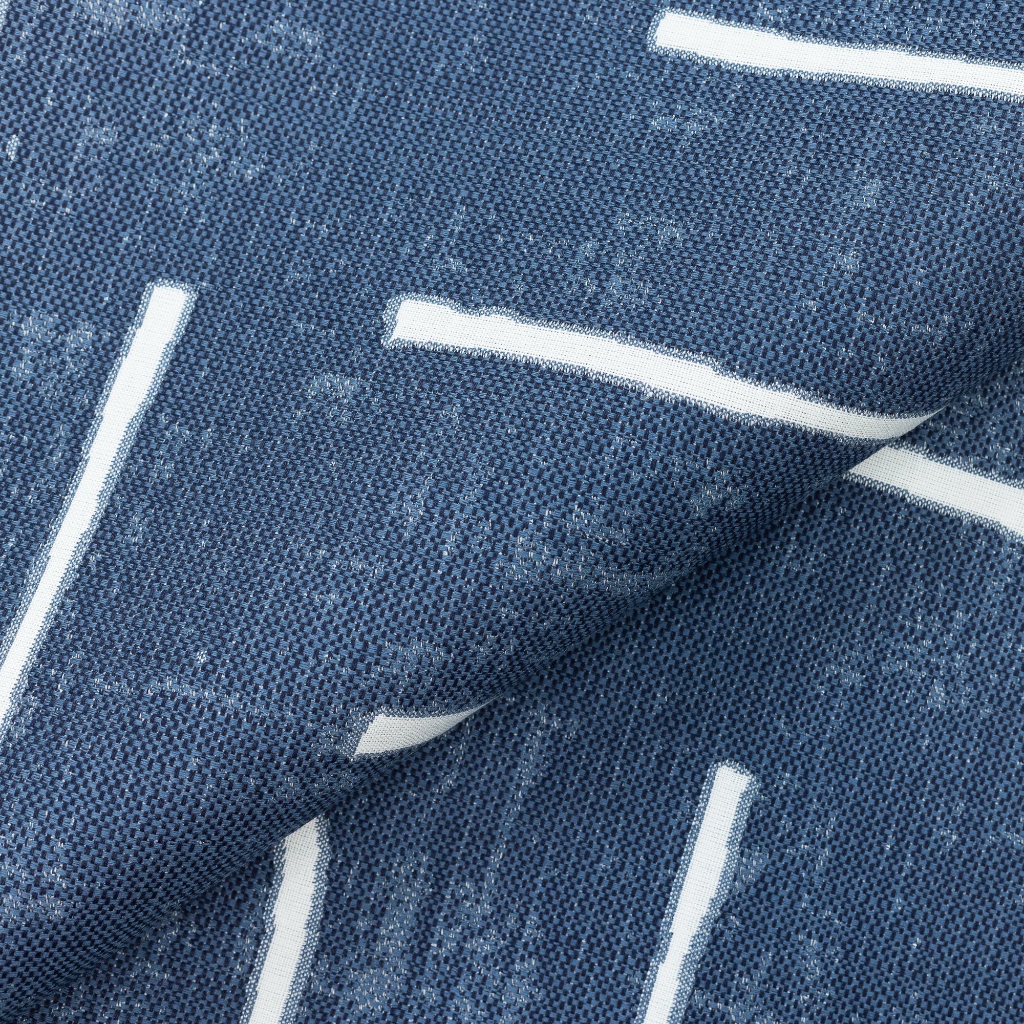 Close shot texture image of Modern outdoor safe fabric featuring denim-inspired blue with minimalist stripe accents