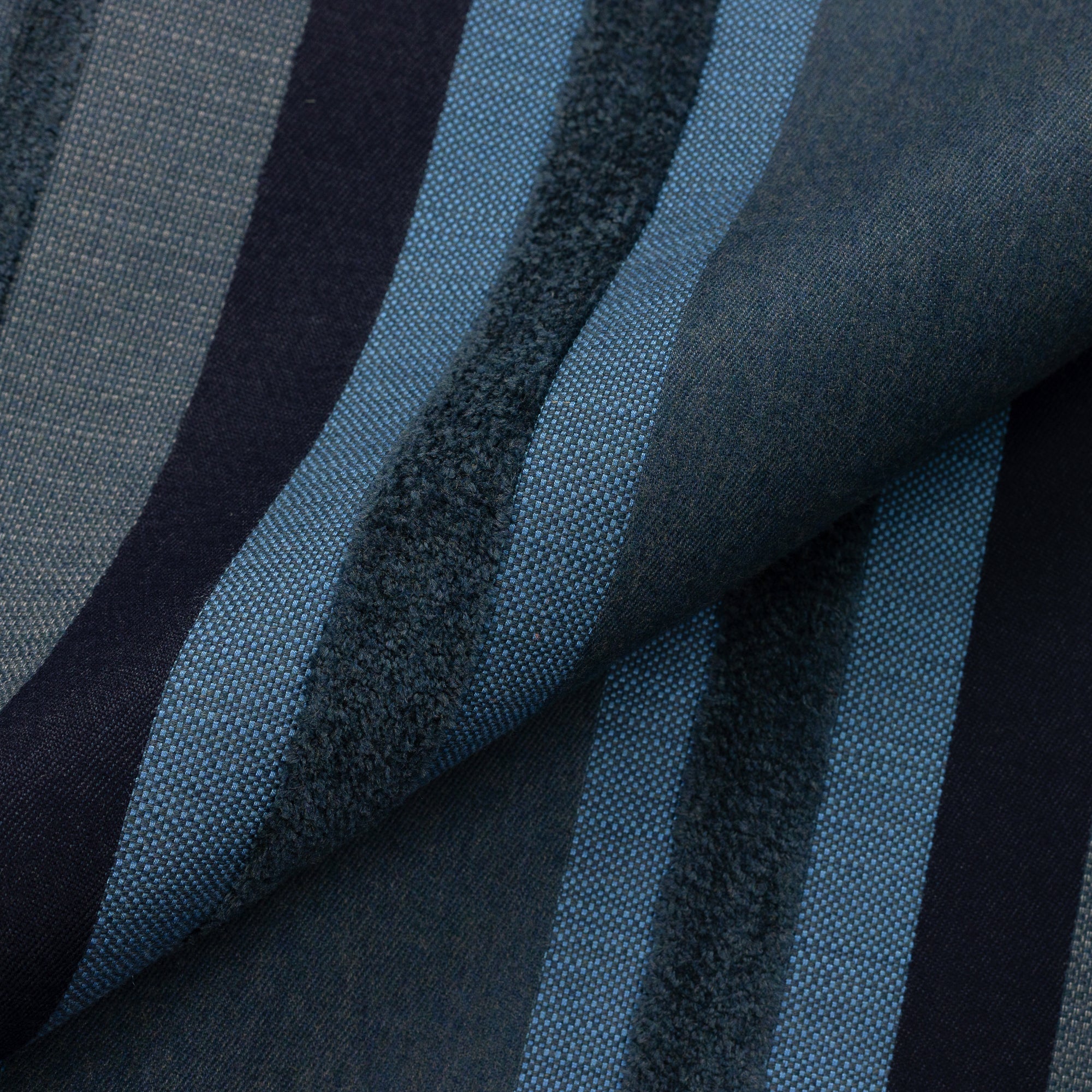 Close shot texture image of Outdoor safe woven fabric with vertical indigo stripe pattern with rich bands of chenille– Intermix Indigo by Elaine Smith