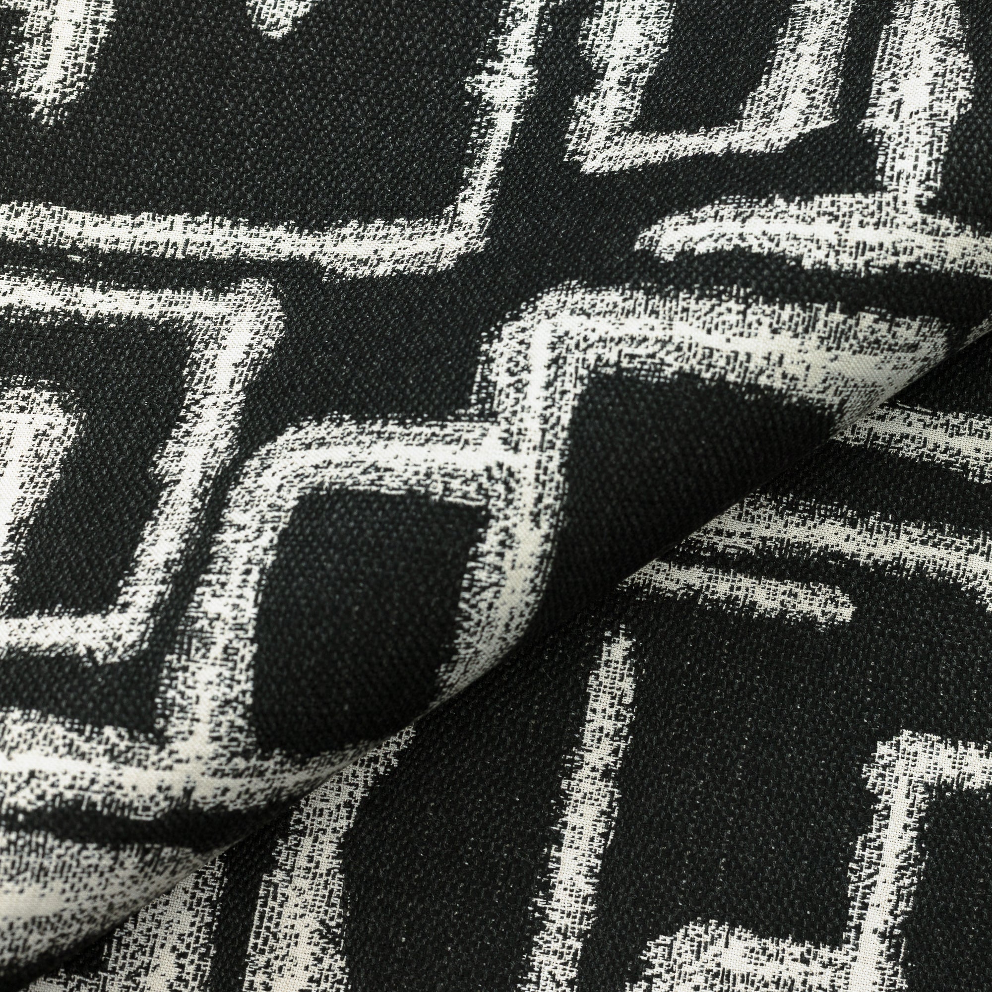 Close shot texture image of Textured ebony outdoor safe performance fabric with maze-like abstract design – Kasai Ebony by Elaine Smith