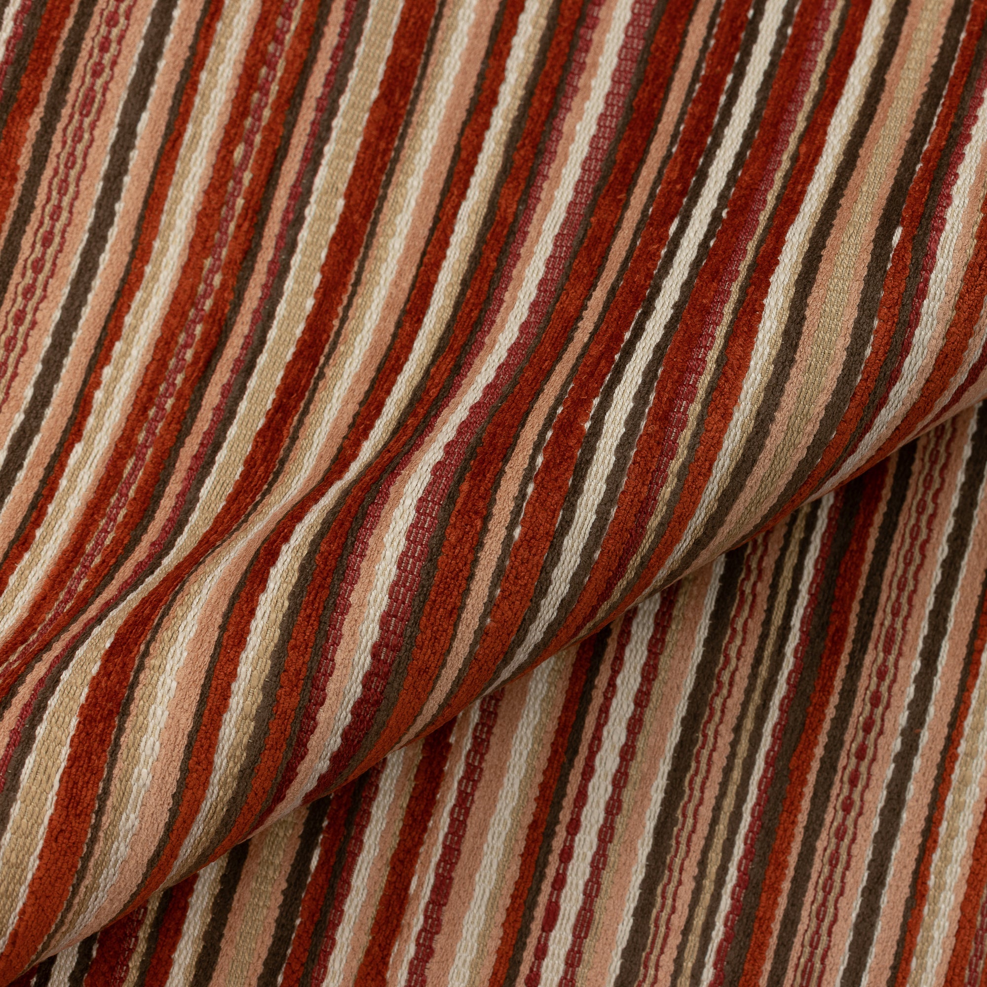 Close shot texture image of Small scale chenille striped multicolor spice-toned velvet outdoor safe fabric