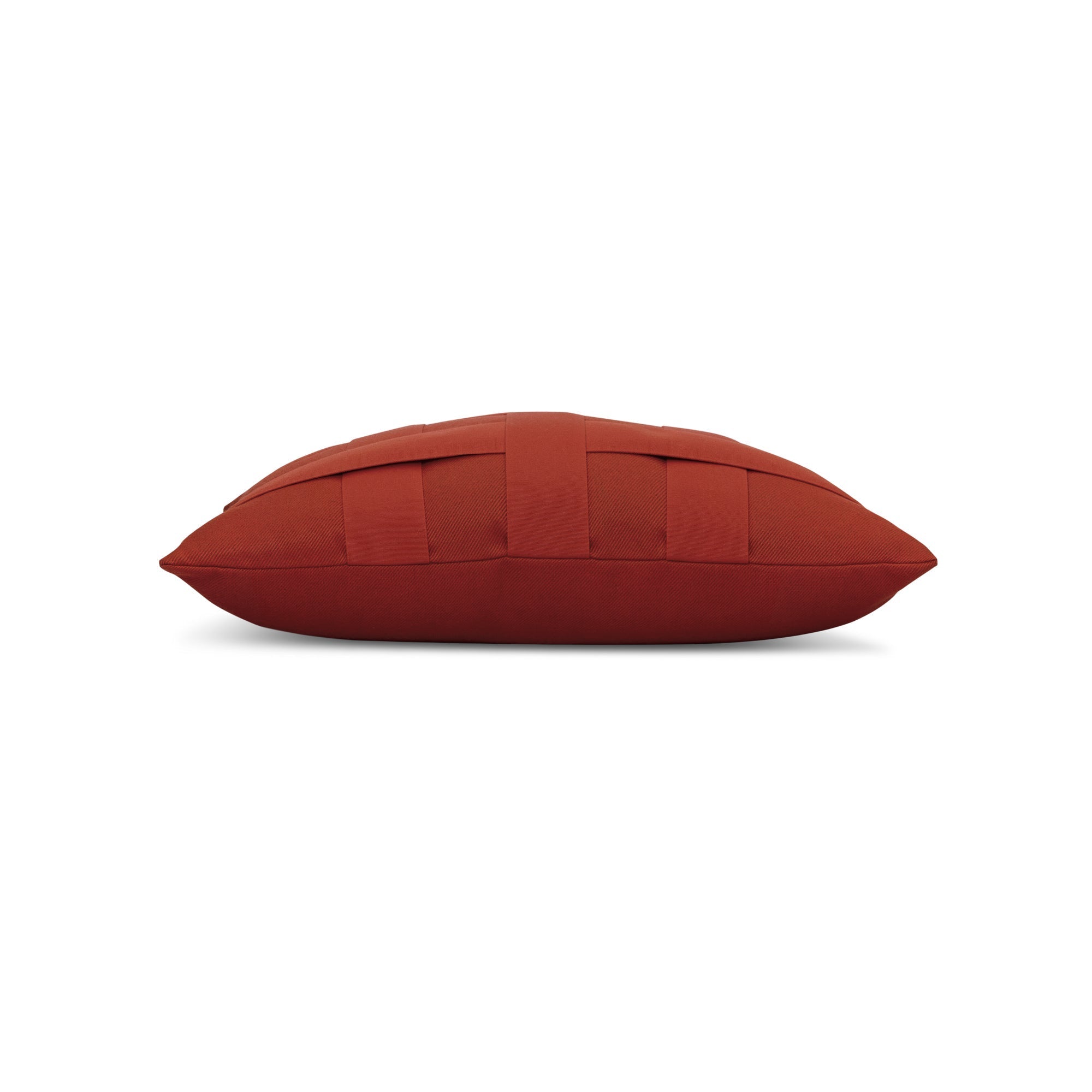 Side image of Rust red outdoor pillow with solid design for bold outdoor accents