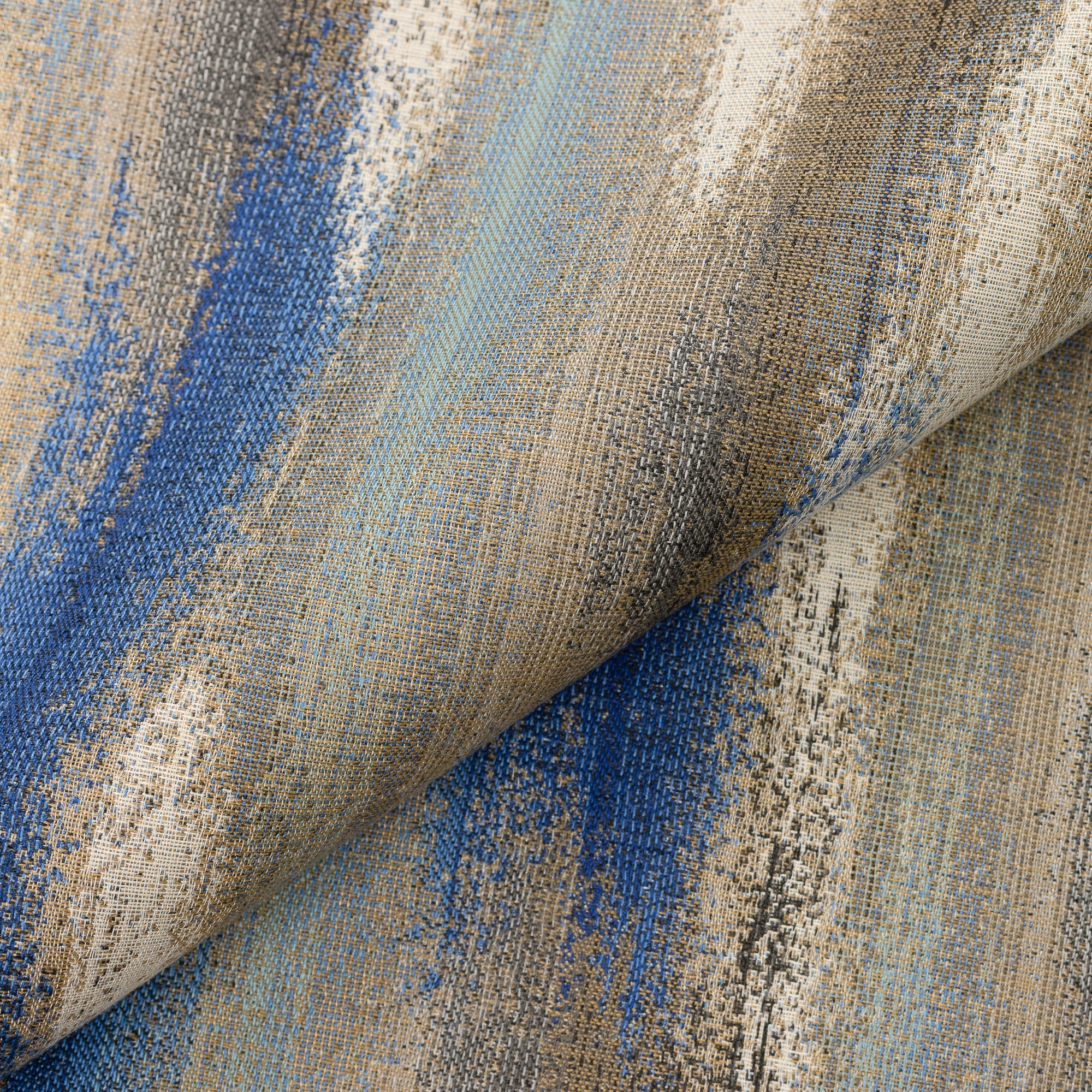 Close shot texture image of Outdoor safe woven fabric featuring Mediterranean-inspired painterly blue and tan textures - Elaine Smith