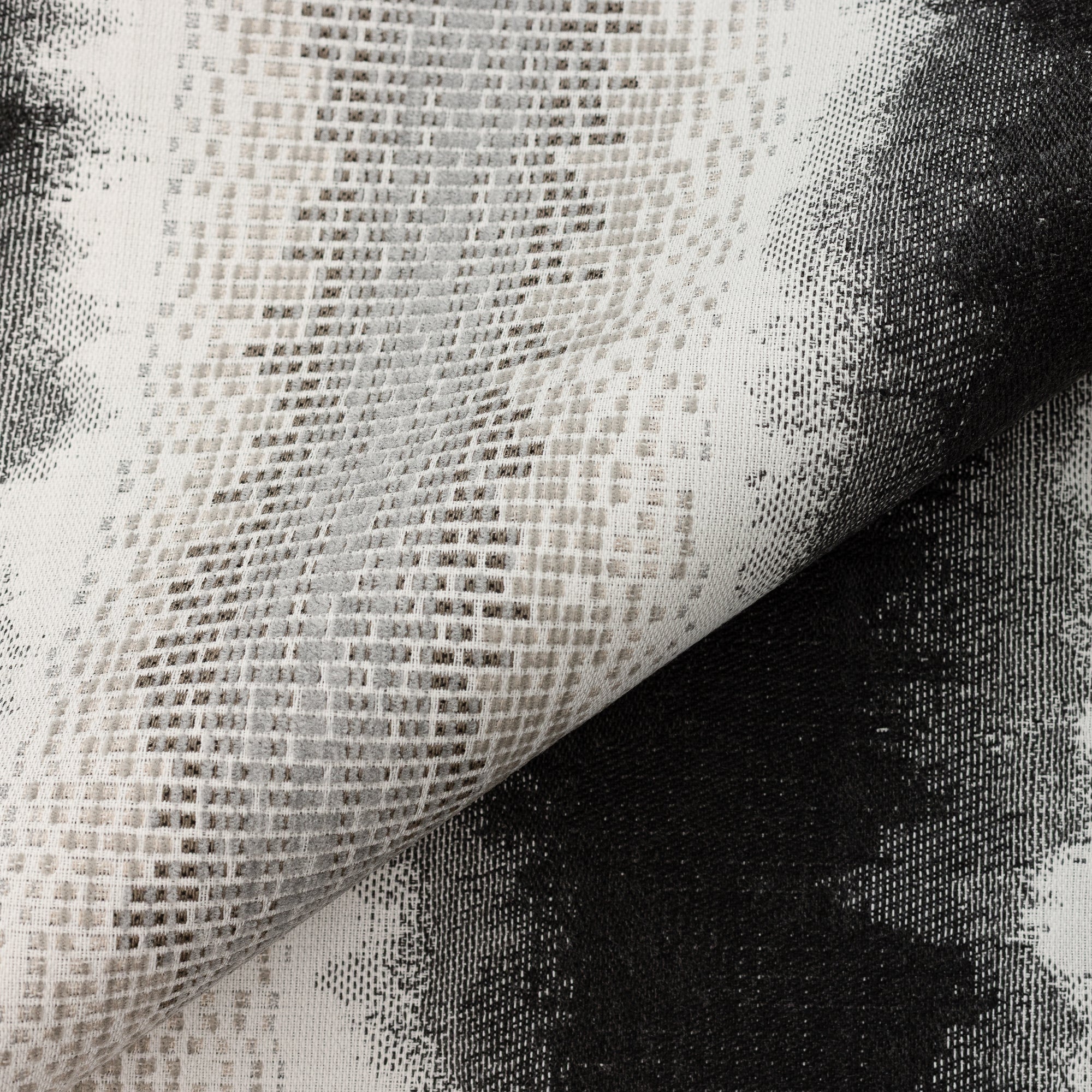 Close shot texture image of Charcoal performance fabric with blended chenille block center band and artistic edge fade design