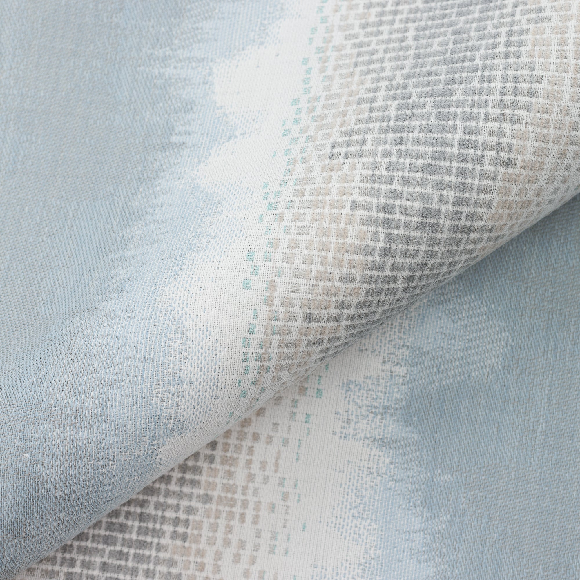 Close shot texture image of Sky blue and white with blended chenille block center band  in  outdoor safe woven fabric with ombre edge
