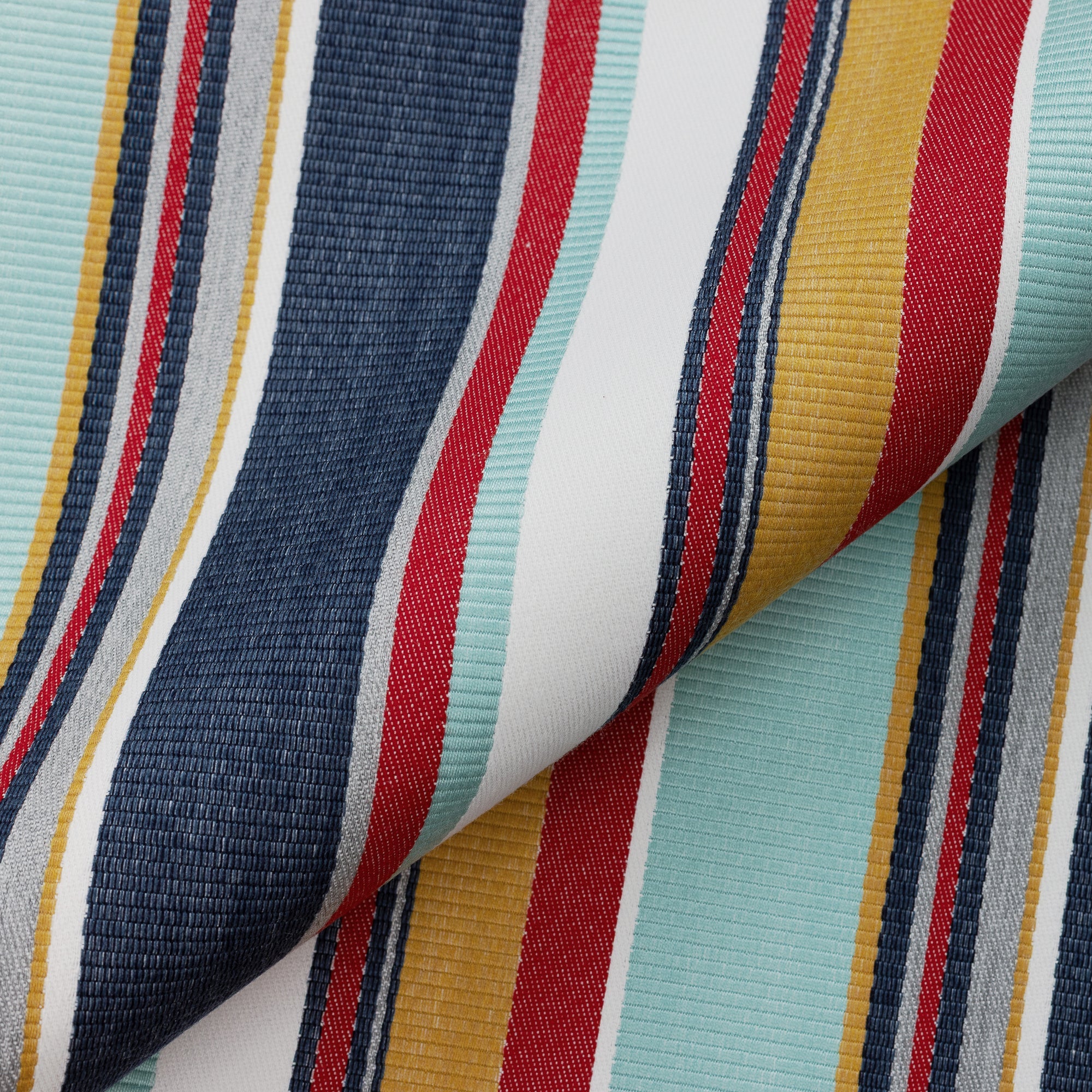 Close shot texture image of Bold multicolor stripe outdoor safe woven fabric with Mediterranean flair – Sicily Stripe by Elaine Smith