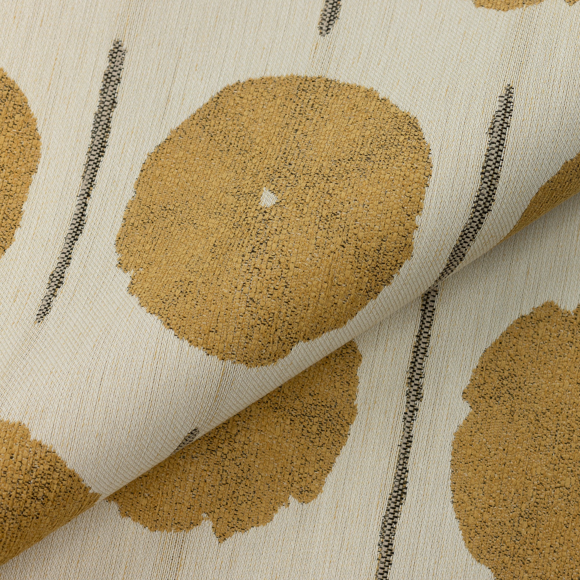Close shot texture image of Gold circular artistic motif on ivory background outdoor safe fabric