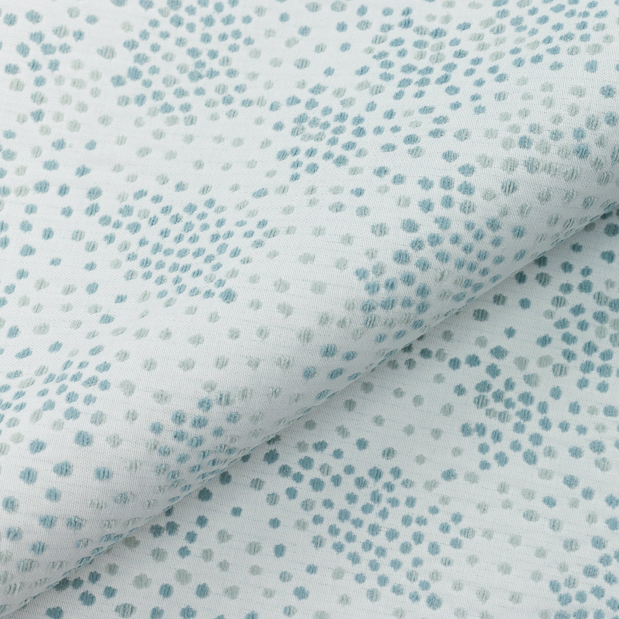 Close shot texture image of Speckle Surf colored tonal chenille yarns outdoor-safe woven fabric by Elaine Smith, ideal for high-end commercial and residential applications.