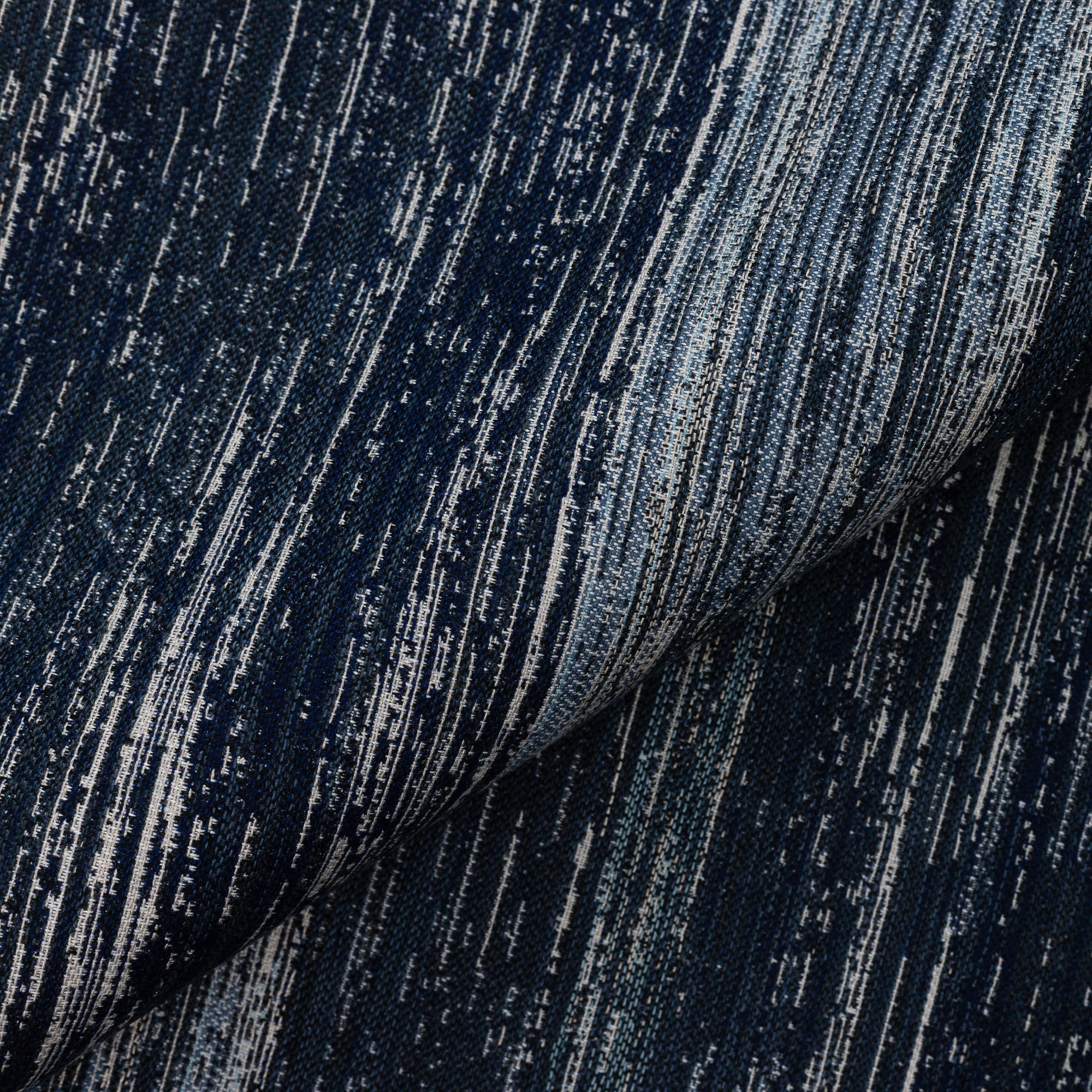 Close shot texture image of Indigo outdoor safe woven textile with streaked texture effect