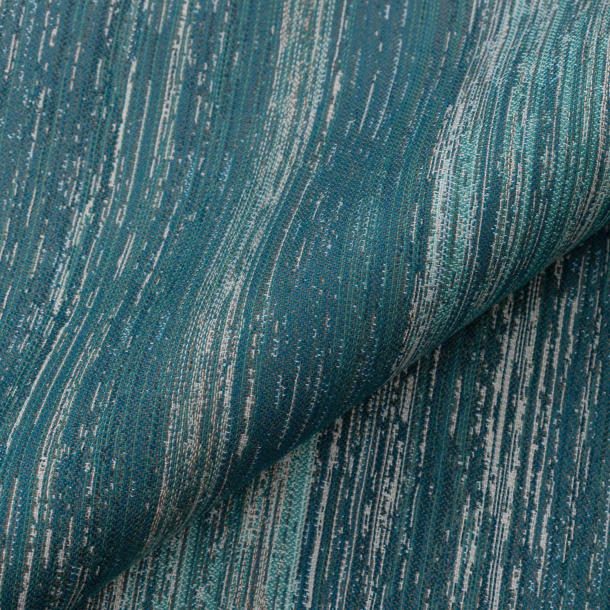 Close shot texture image of Lagoon-toned outdoor-safe fabric with textured vertical streaks