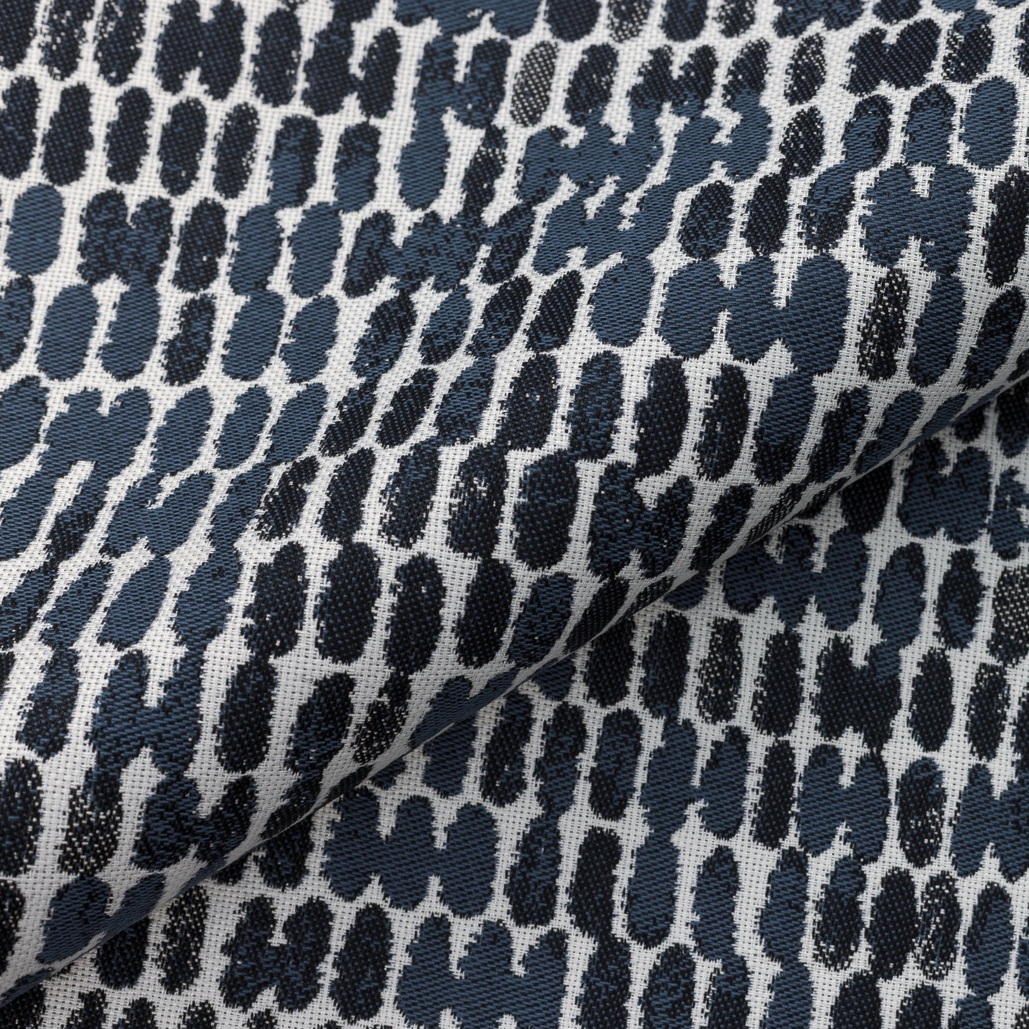 Close shot texture image of Luxury outdoor safe woven fabric with bold indigo abstract thumbprint pattern