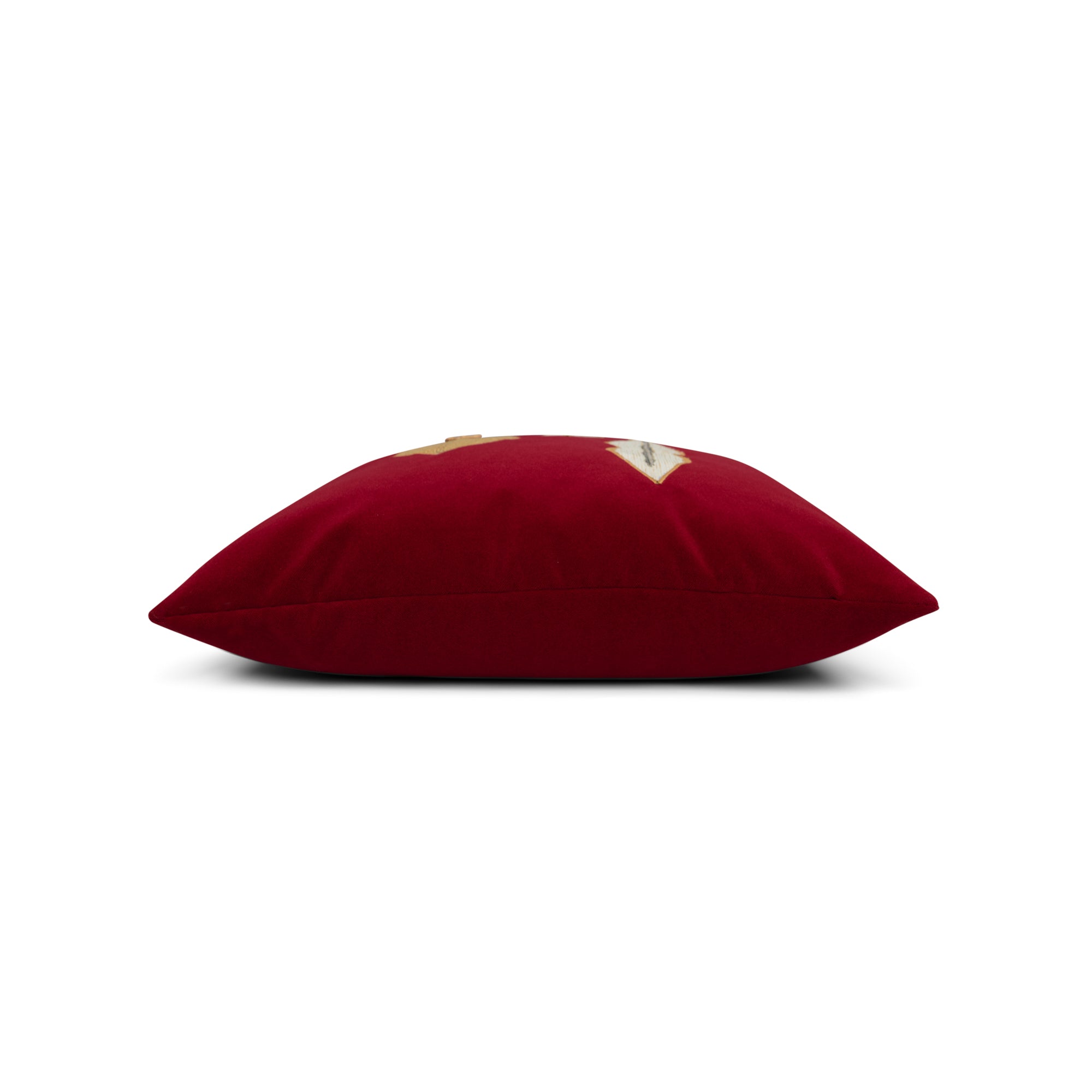 Side image of Ruby red velvet pillow with gold ornament hand stitched details in square size for holiday and seasonal indoor and outdoor decor